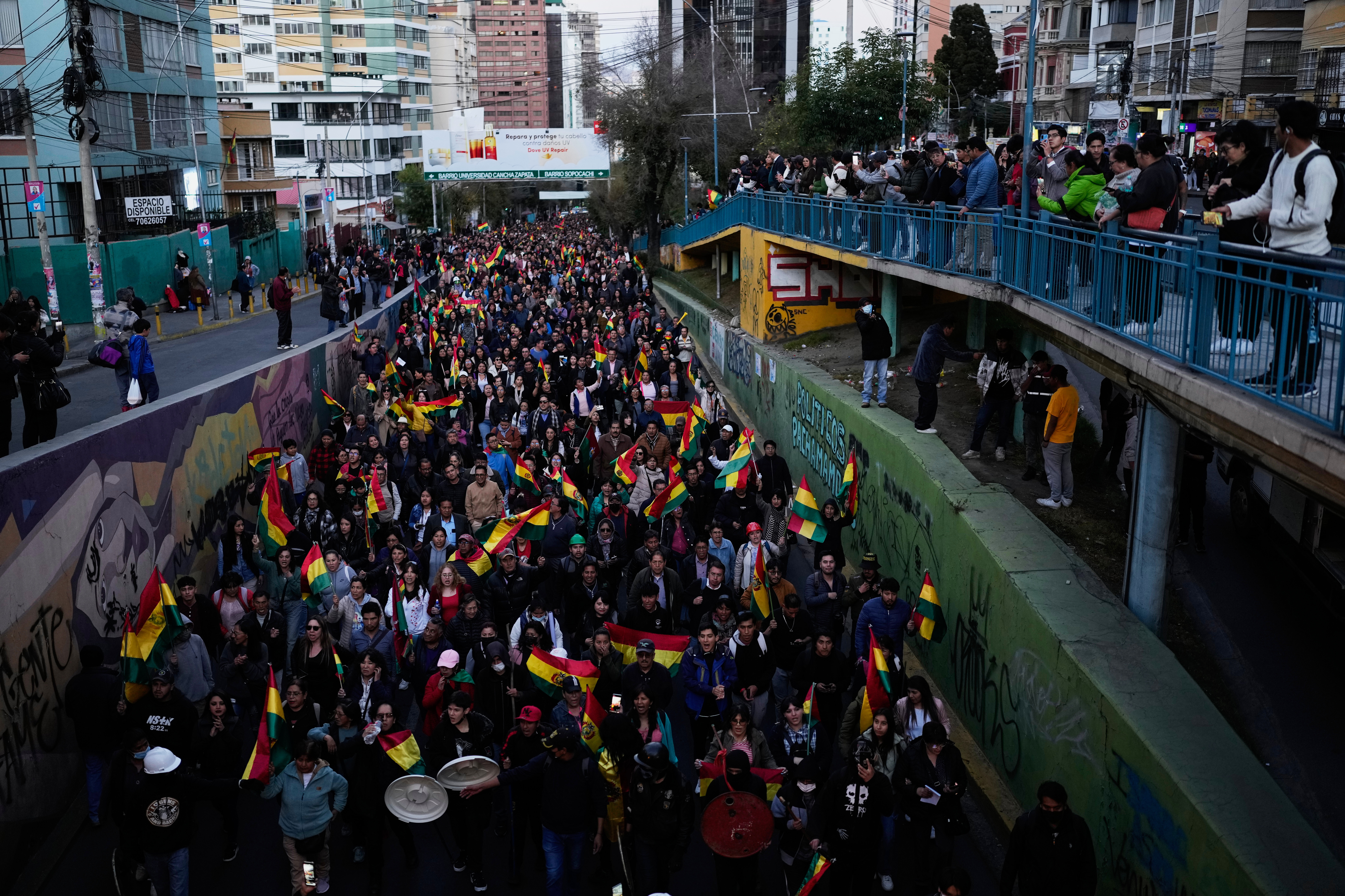 People march against protesters blocking the access to the city, in La Paz, Bolivia, Wednesday, May 20, 2026