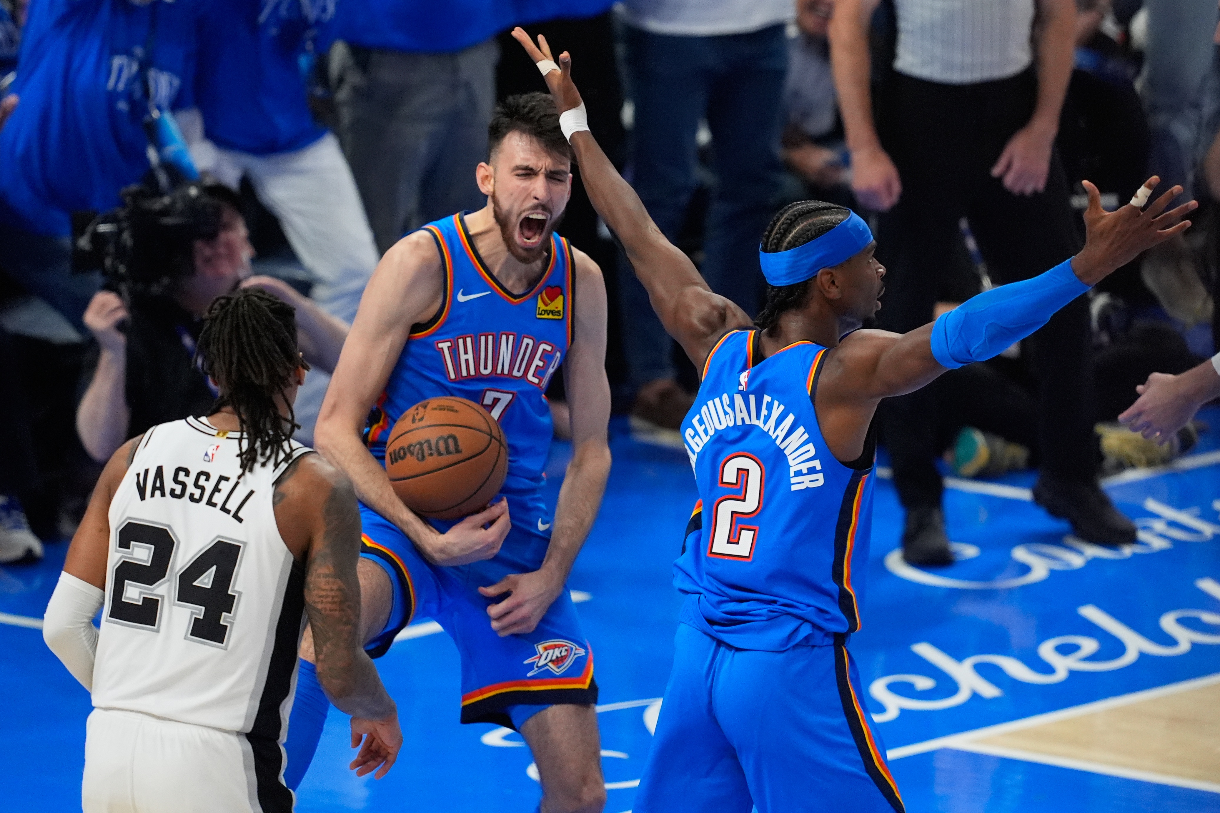 Oklahoma City Thunder center Chet Holmgren (7) celebrates with guard Shai Gilgeous-Alexander (2).
