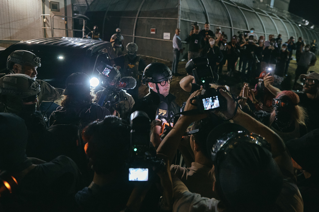 a crowd outside a migrant detention centre