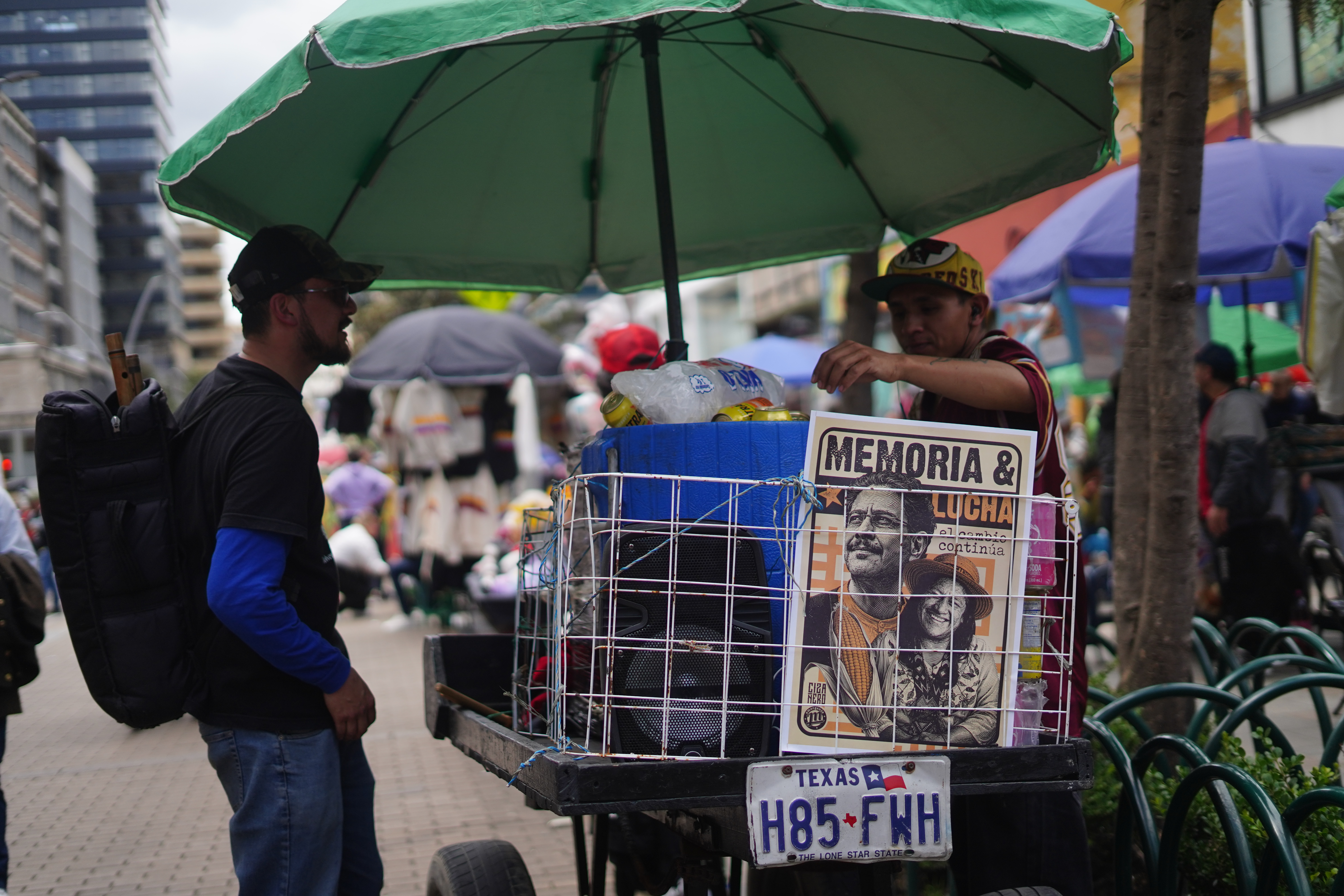 A street vendor in Bogotá carries campaign materials for left-wing presidential candidate Iván Cepeda and his running mate, Aida Quilcué. May 1, 2026