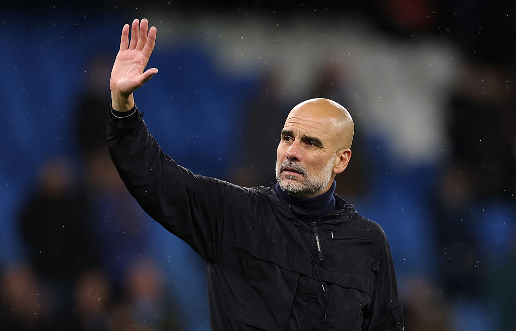 Pep Guardiola, Manager of Manchester City, waves to the crowd after the Premier League match