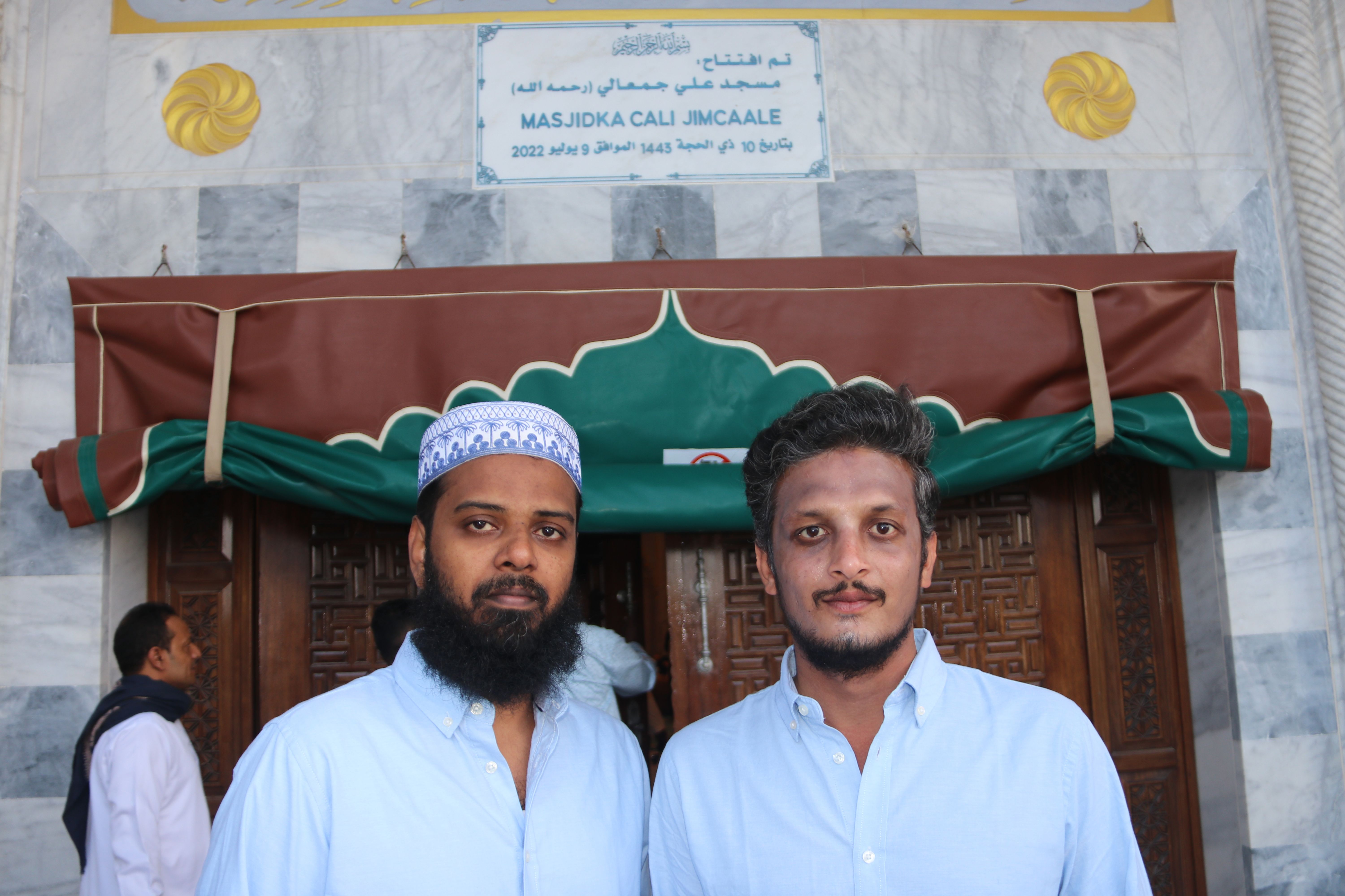 Fahad and Shahul moved to Somalia from southern India and have lived in Mogadishu for more than a year. Ali Jimale Mosque is one of their favourite places of worship in the city, known for its scale and distinctive architecture. [Faisal Ali/Al Jazeera]