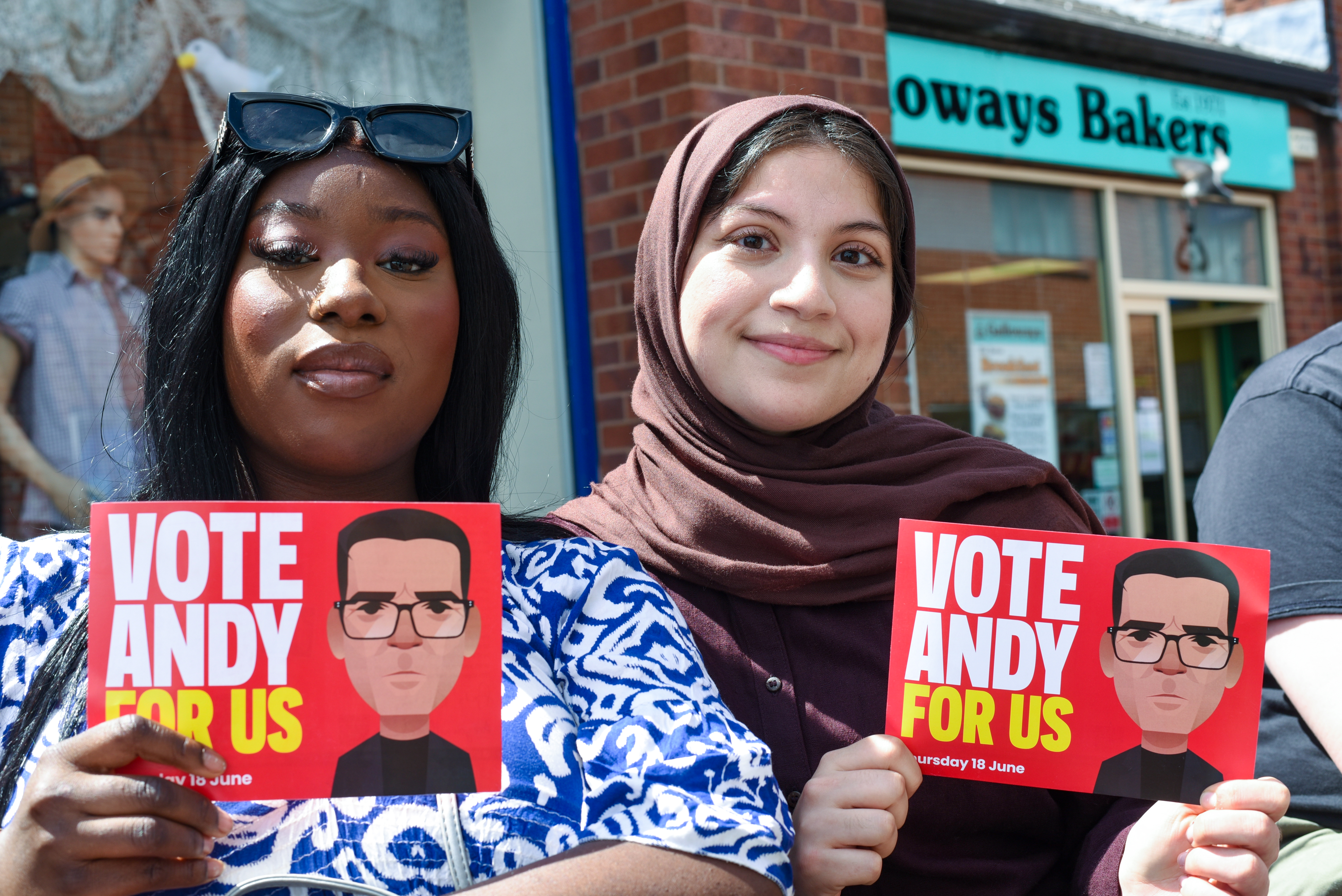 Sarata Sawo (L) and Alia Patel (R) activists with Young Labour in Ashton-in-Makerfield [Simon Speakman Cordall/Al Jazeera]