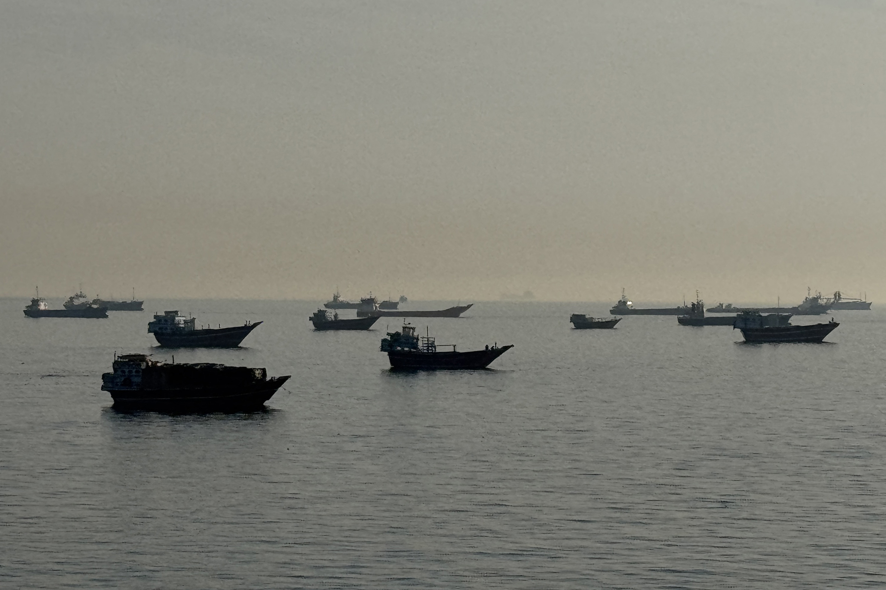 Vessels are seen anchored in the water.