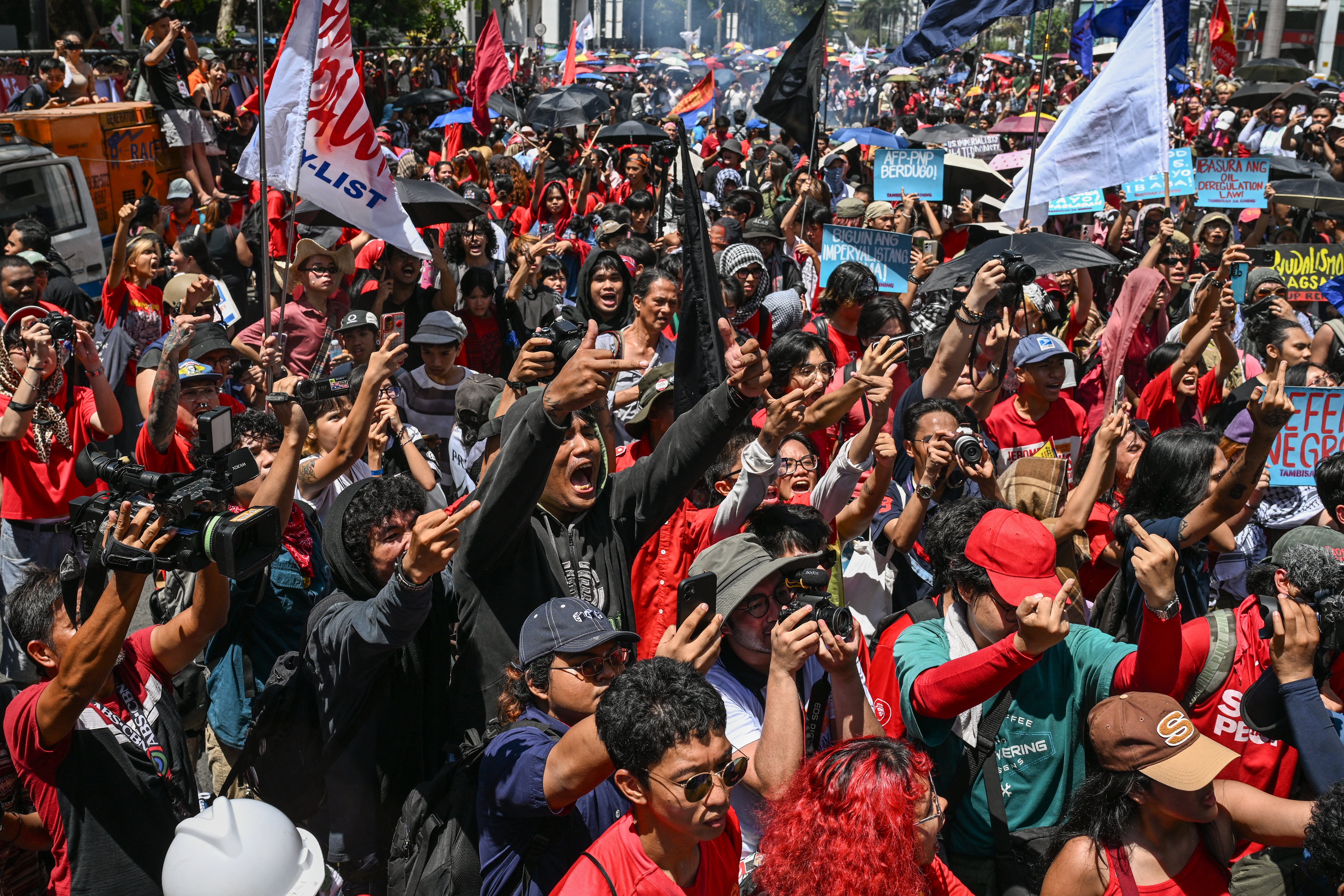 Protesters stage a demonstration to mark International Labour Day in Manila on May 1, 2026. (Photo by Jam STA ROSA / AFP)