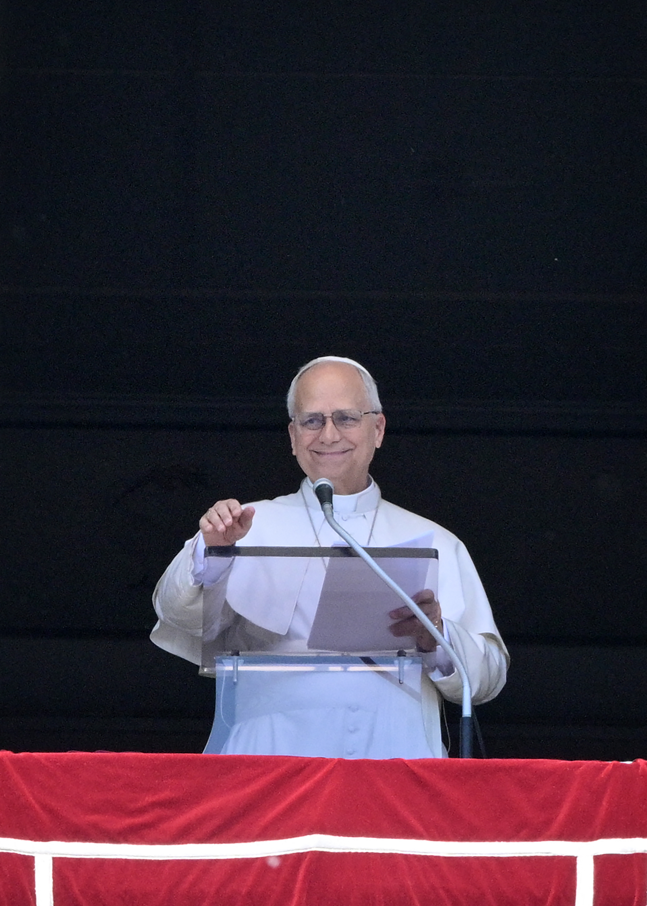 Pope Leo XIV addresses the crowd from a window of the Apostolic Palace overlooking St. Peter's Square during the Regina Coeli prayer in the Vatican on May 3, 2026. (Photo by TIZIANA FABI / AFP)