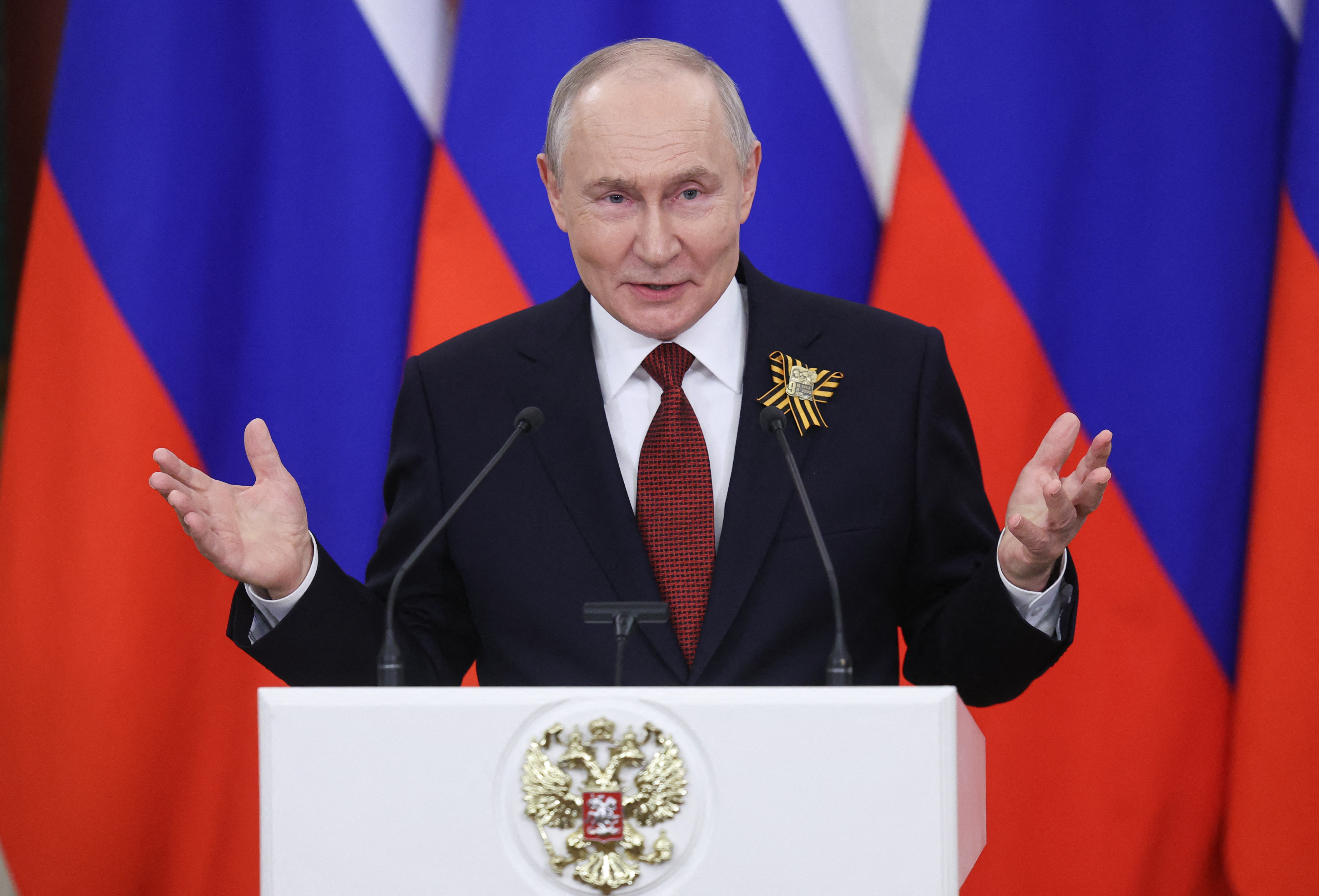 Russian President Vladimir Putin talks to the media following his meetings with foreign delegations at the Kremlin in Moscow on May 9, 2026. (Photo by MAXIM SHIPENKOV / POOL / AFP)