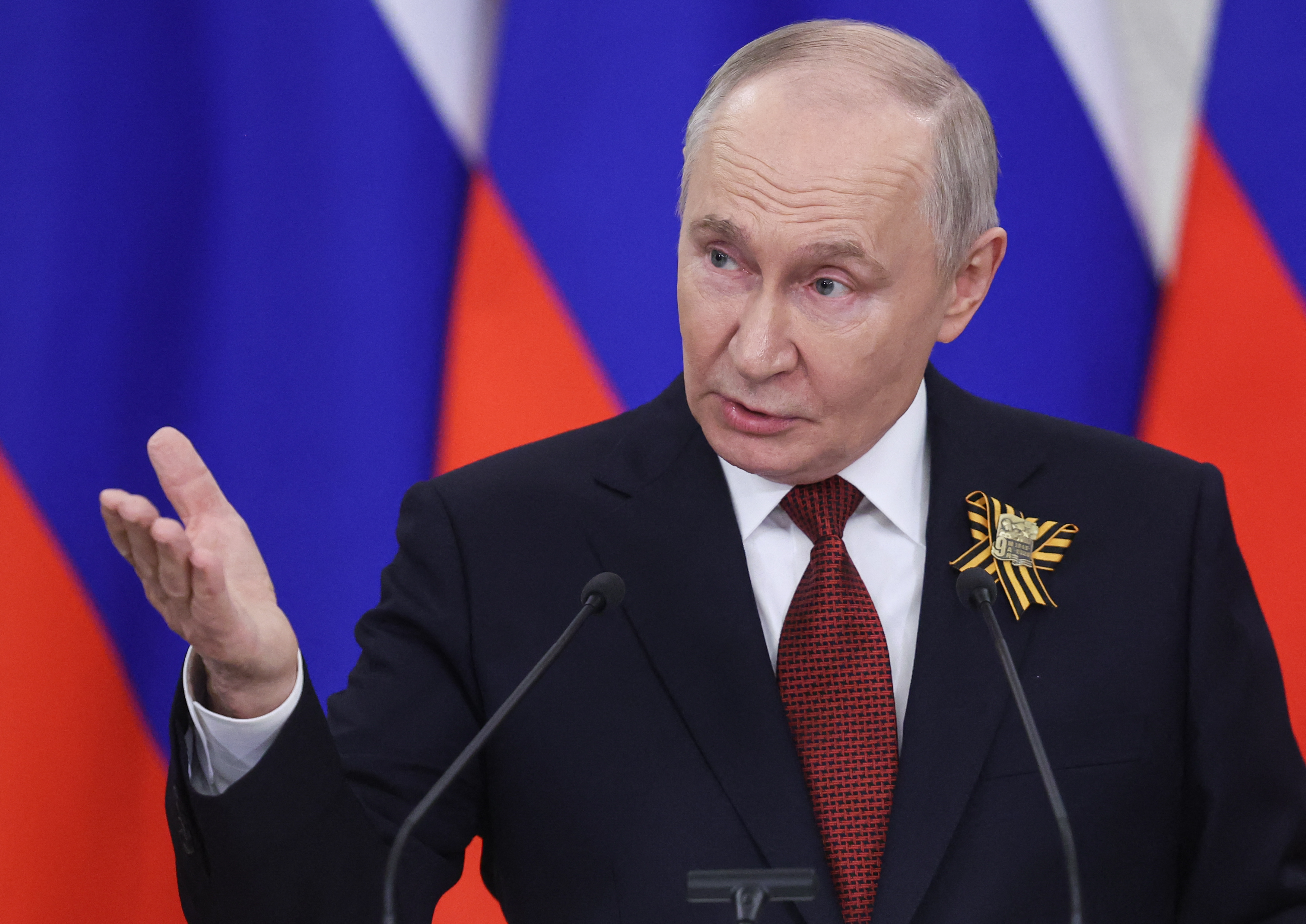 Russian President Vladimir Putin talks to the media following his meetings with foreign delegations at the Kremlin in Moscow on May 9, 2026. (Photo by MAXIM SHIPENKOV / POOL / AFP)