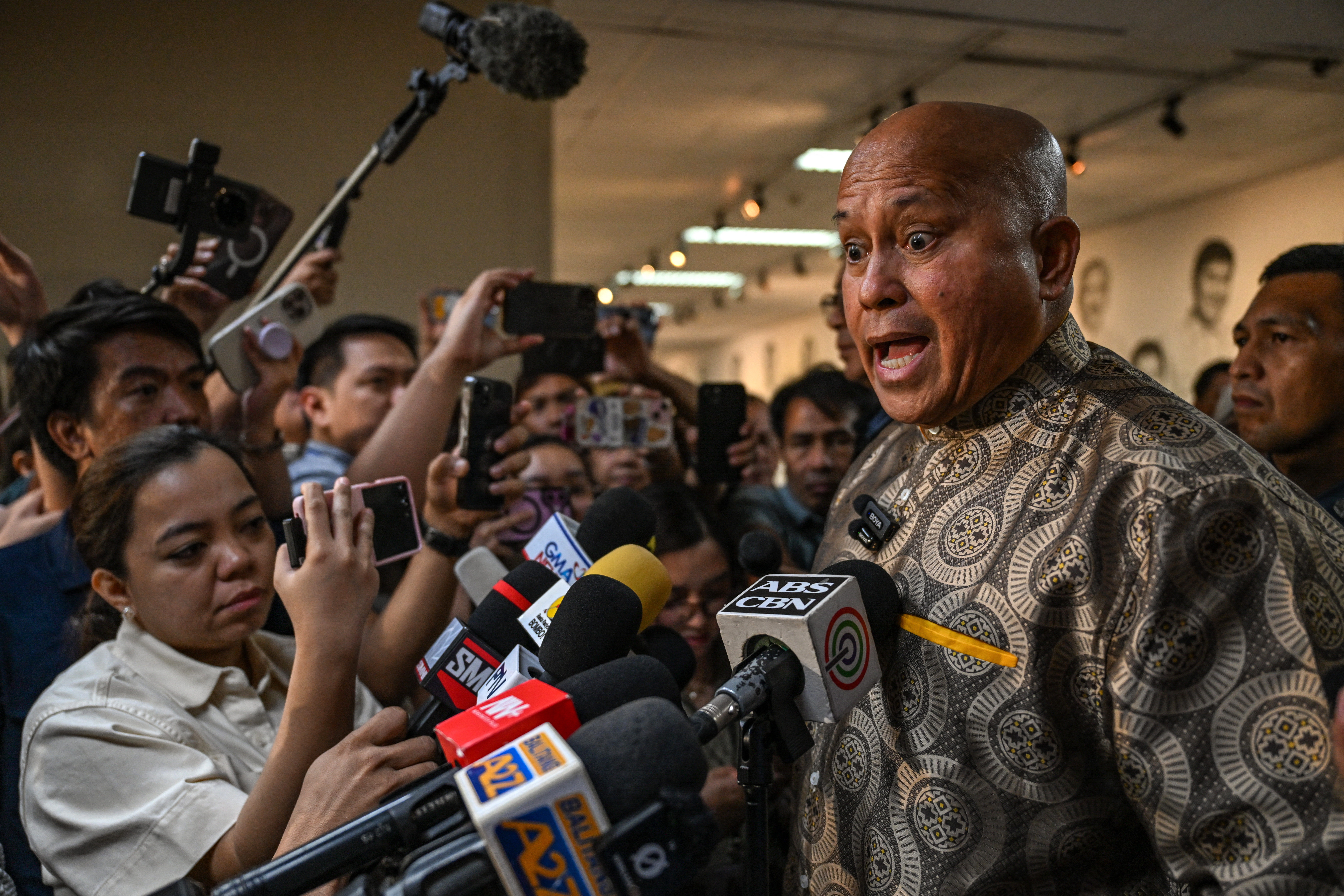 Philippine Senator Ronald dela Rosa talks to reporters at the Senate in Manila