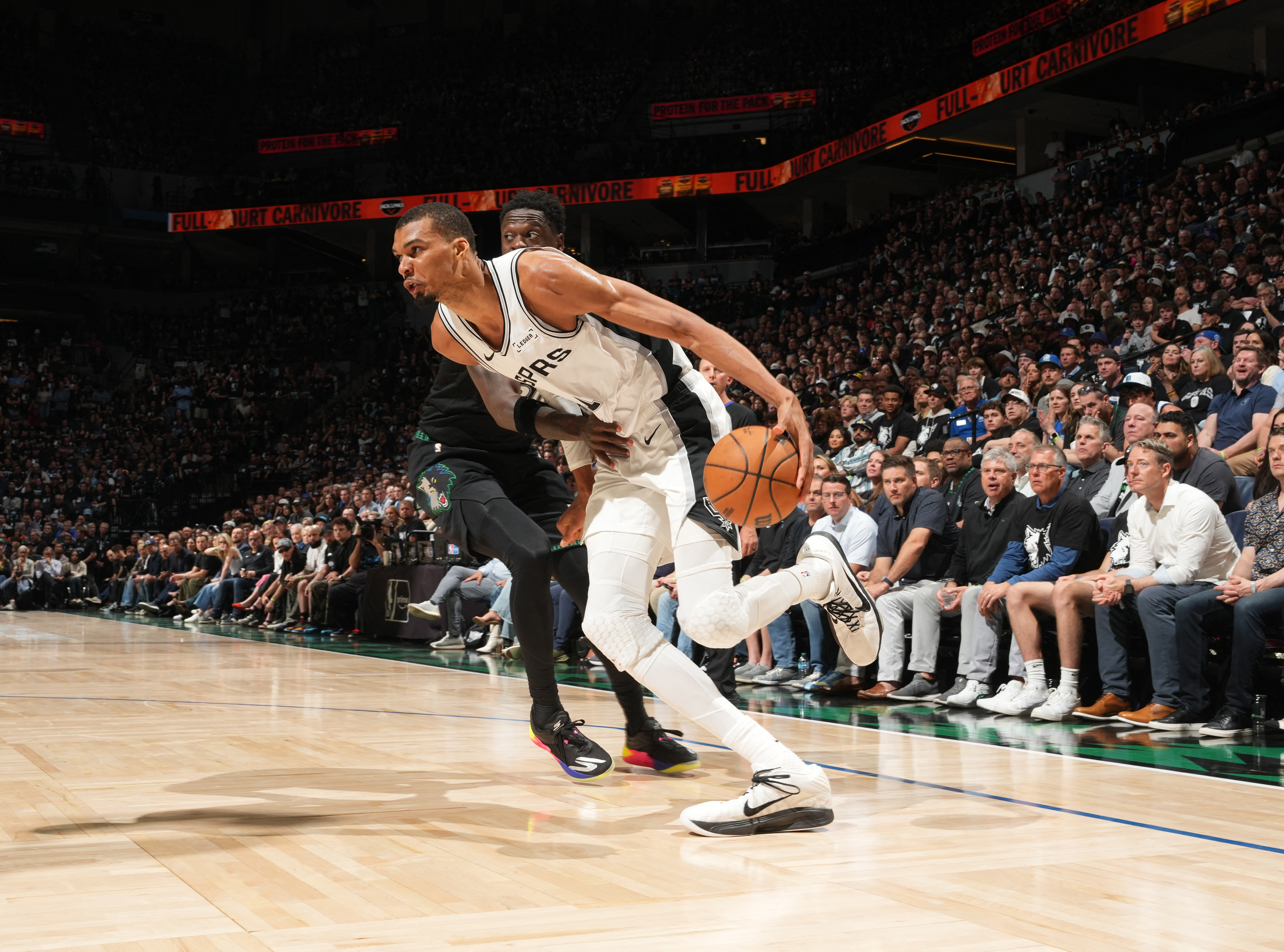 Victor Wembanyama #1 of the San Antonio Spurs drives to the basket during the game.