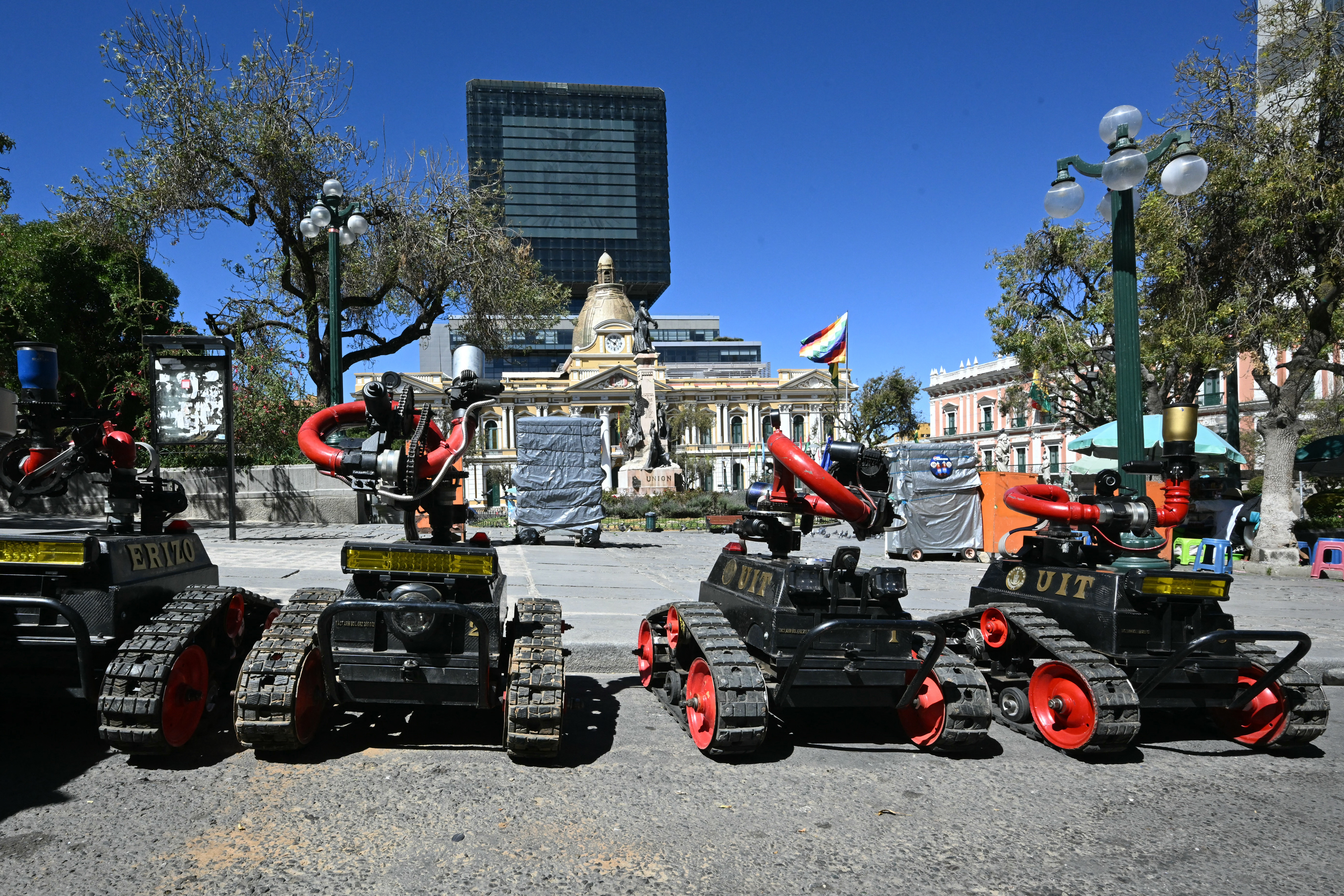 Remote-controlled riot-control robots are deployed in Plaza Murillo near government buildings in La Paz on May 16, 2026.