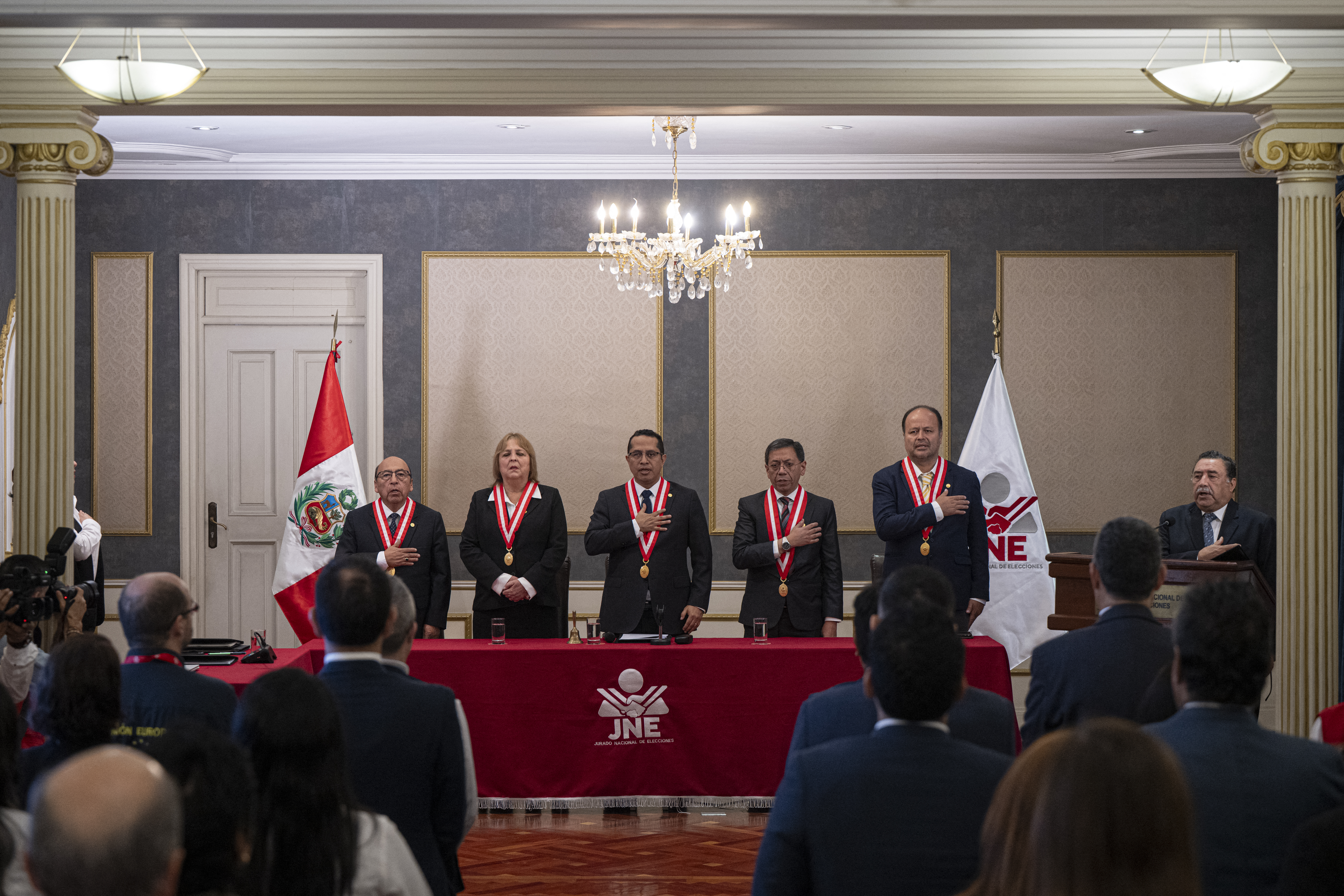 Peru's National Jury of Elections (JNE) president Roberto Burneo Bermejo (C), accompanied by other JNE authorities, attends an event at the JNE headquarters to announce the official results of the April 12 presidential election in Lima on May 17, 2026.