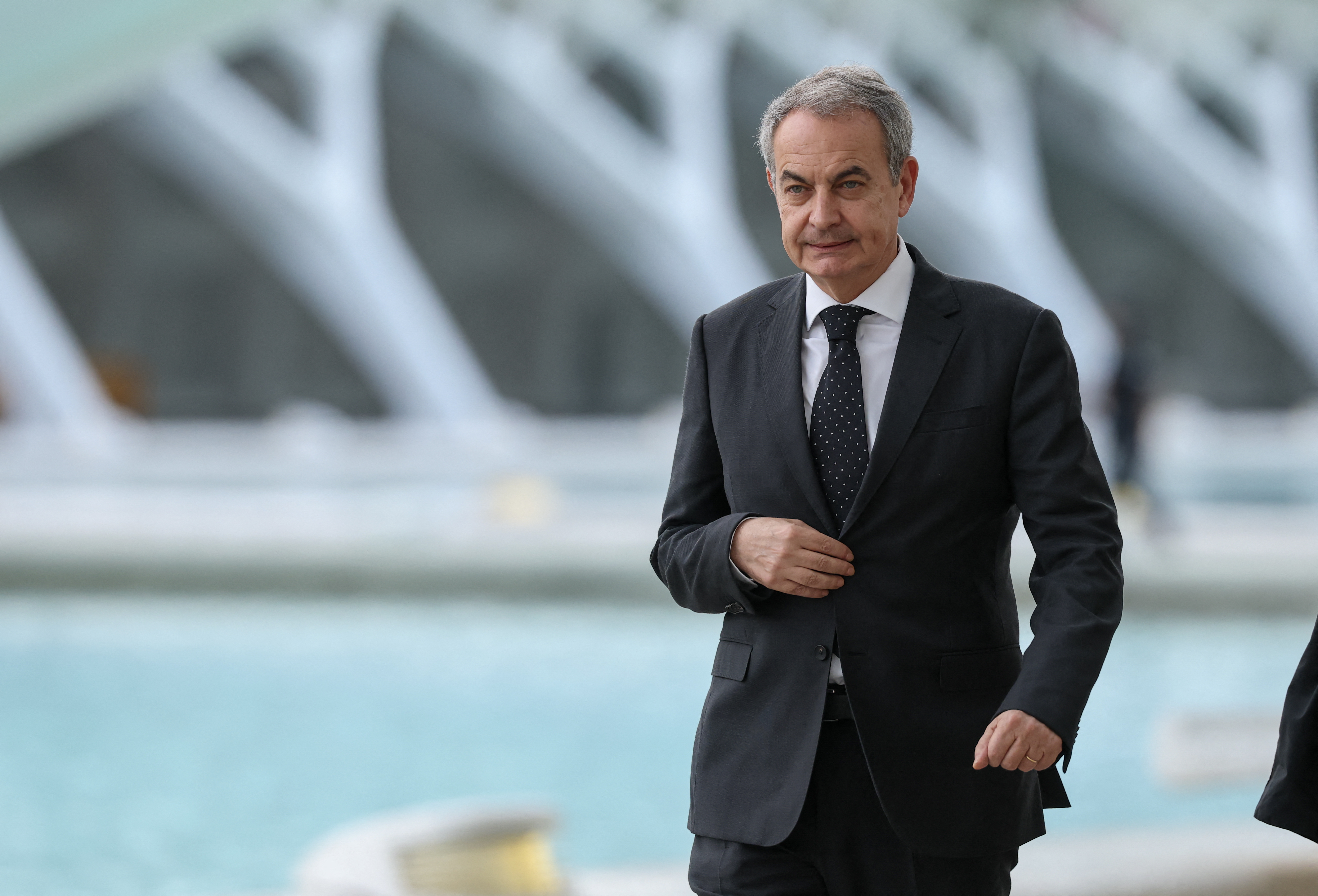 (FILES) Former Spanish Prime Minister Jose Luis Rodriguez Zapatero arrives to attend a state memorial for the more than 230 victims of last year's floods on the one year anniversary of the disaster at the City of Arts and Sciences cultural and architectural complex in Valencia on October 29, 2025.