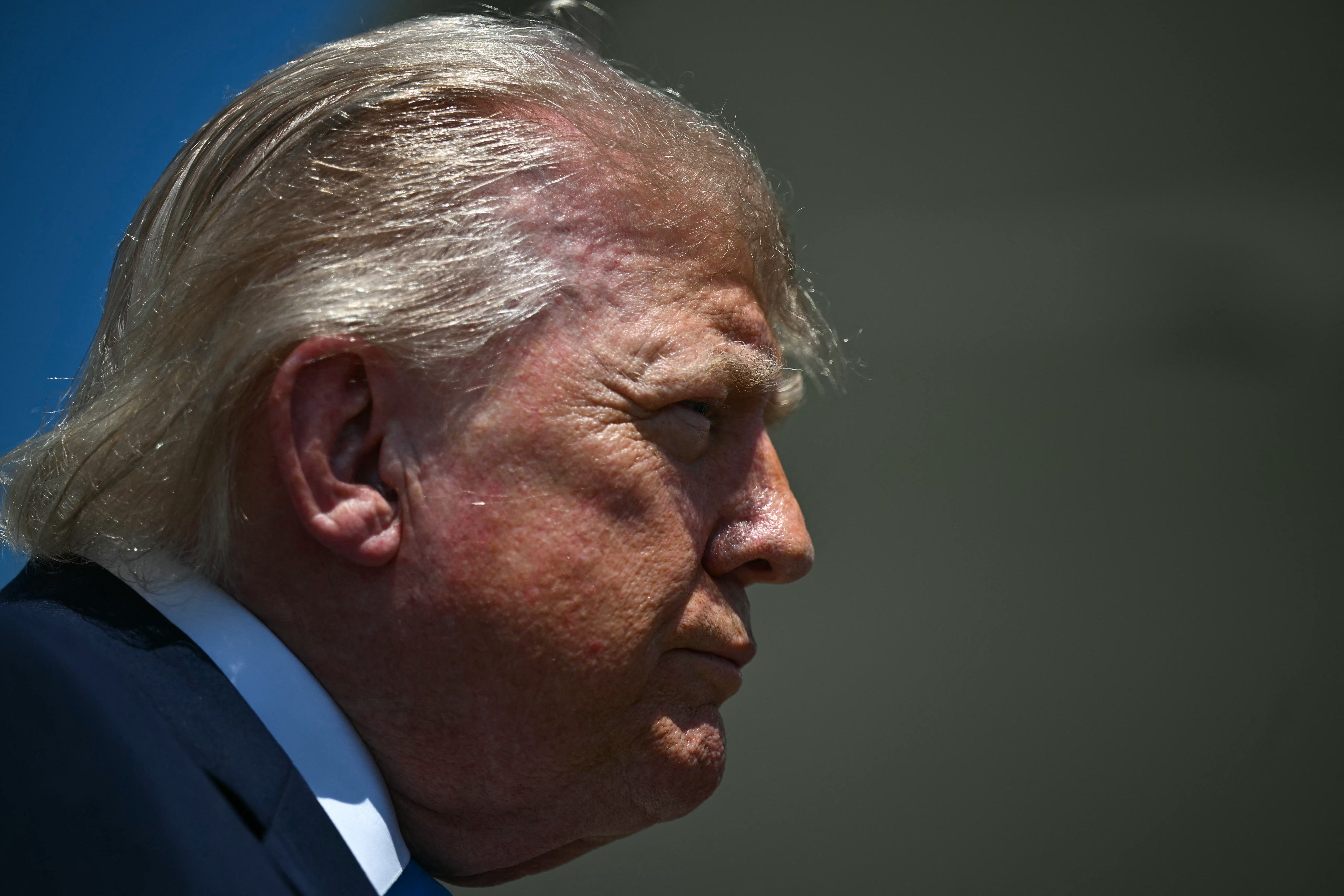 US President Donald Trump speaks to reporters.