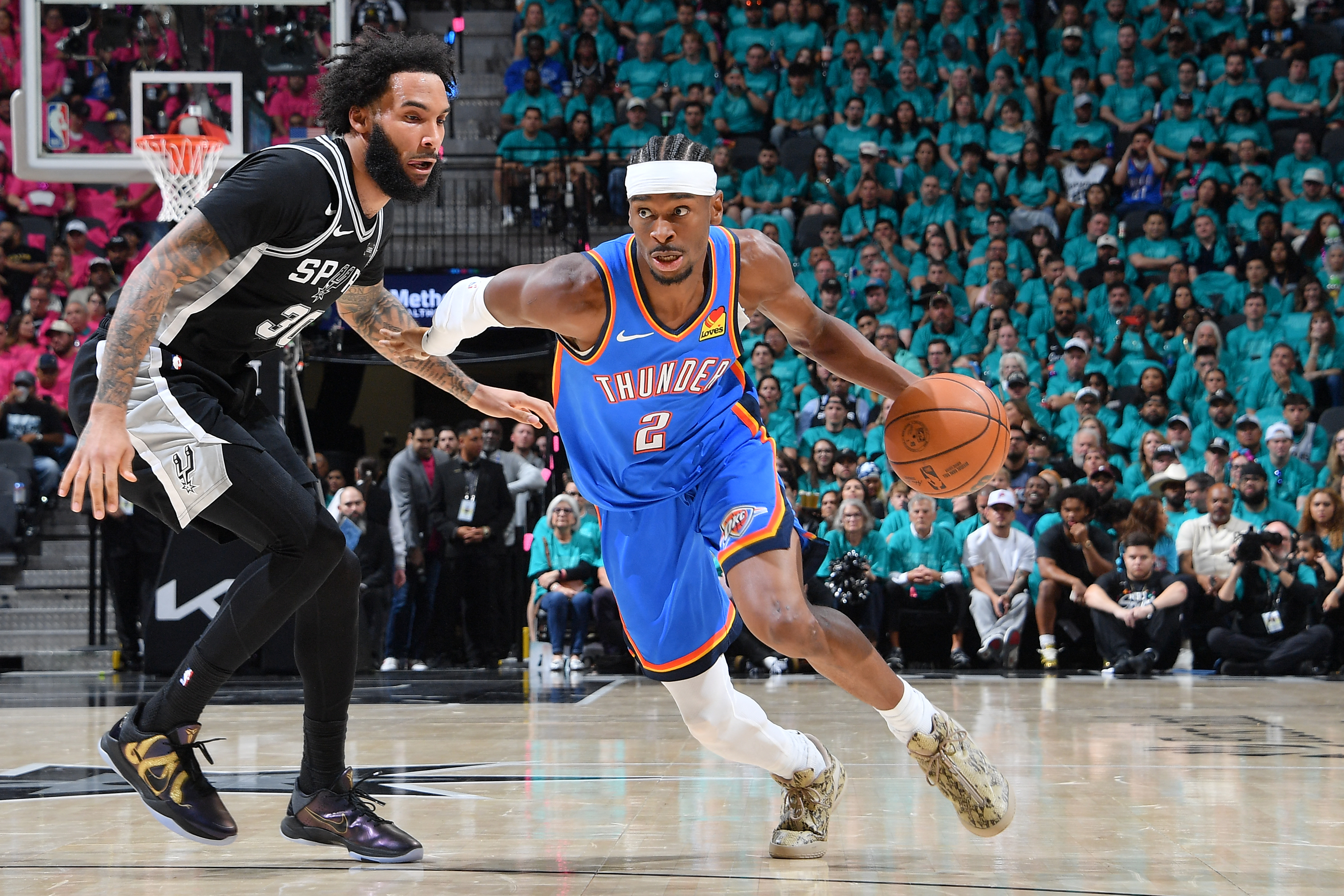 Shai Gilgeous-Alexander #2 of the Oklahoma City Thunder dribbles the ball during the game.
