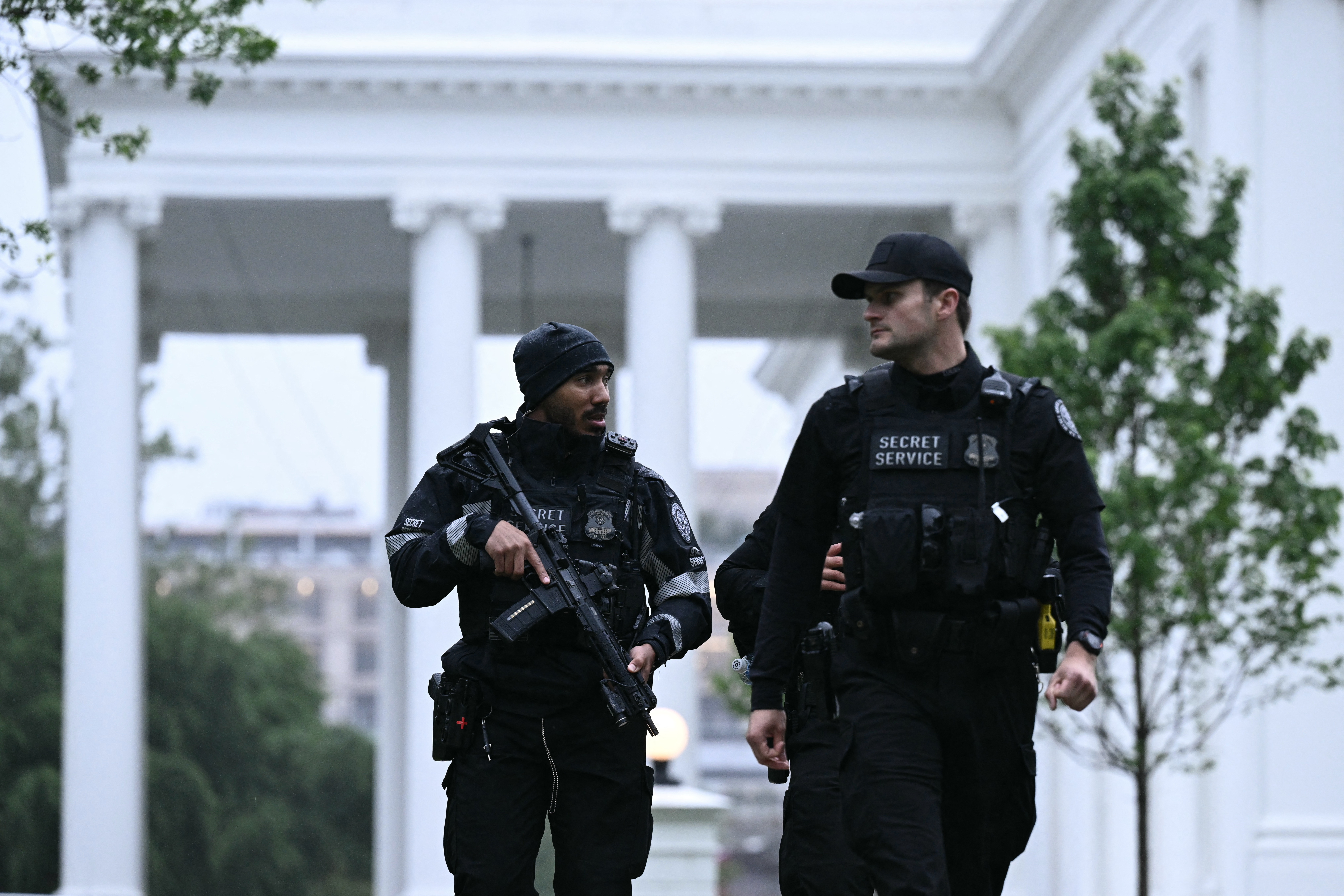 Secret Service agents are seen after a lockdown was lifted at the White House in Washington, DC, on May 23, 2026.