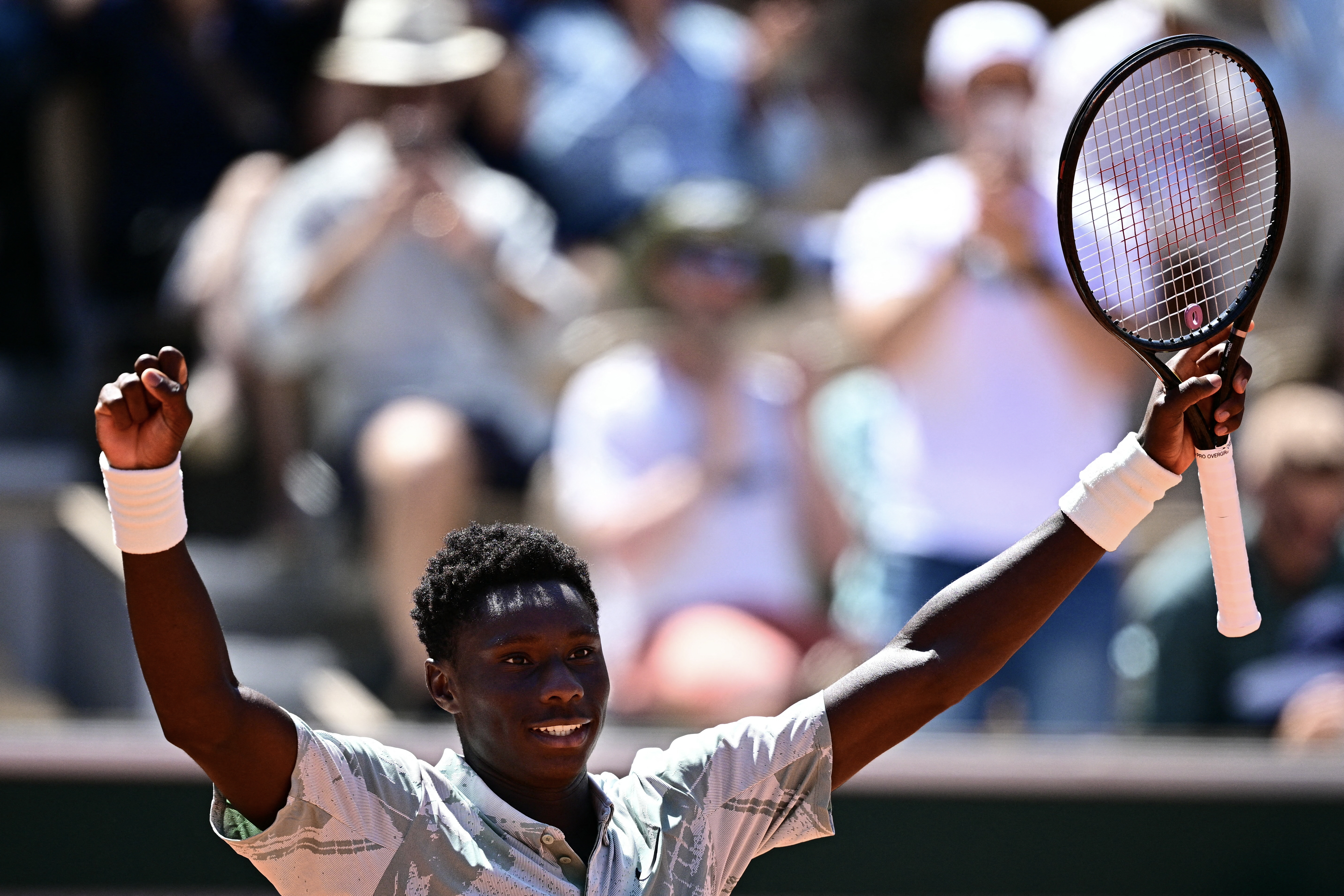 France's Moise Kouame celebrates his victory over Croatia's Marin Cilic during their men's singles match on day 3 of the French Open tennis tournament on Court Simonne-Mathieu at the Roland-Garros Complex in Paris on May 26, 2026. (Photo by JULIEN DE ROSA / AFP)