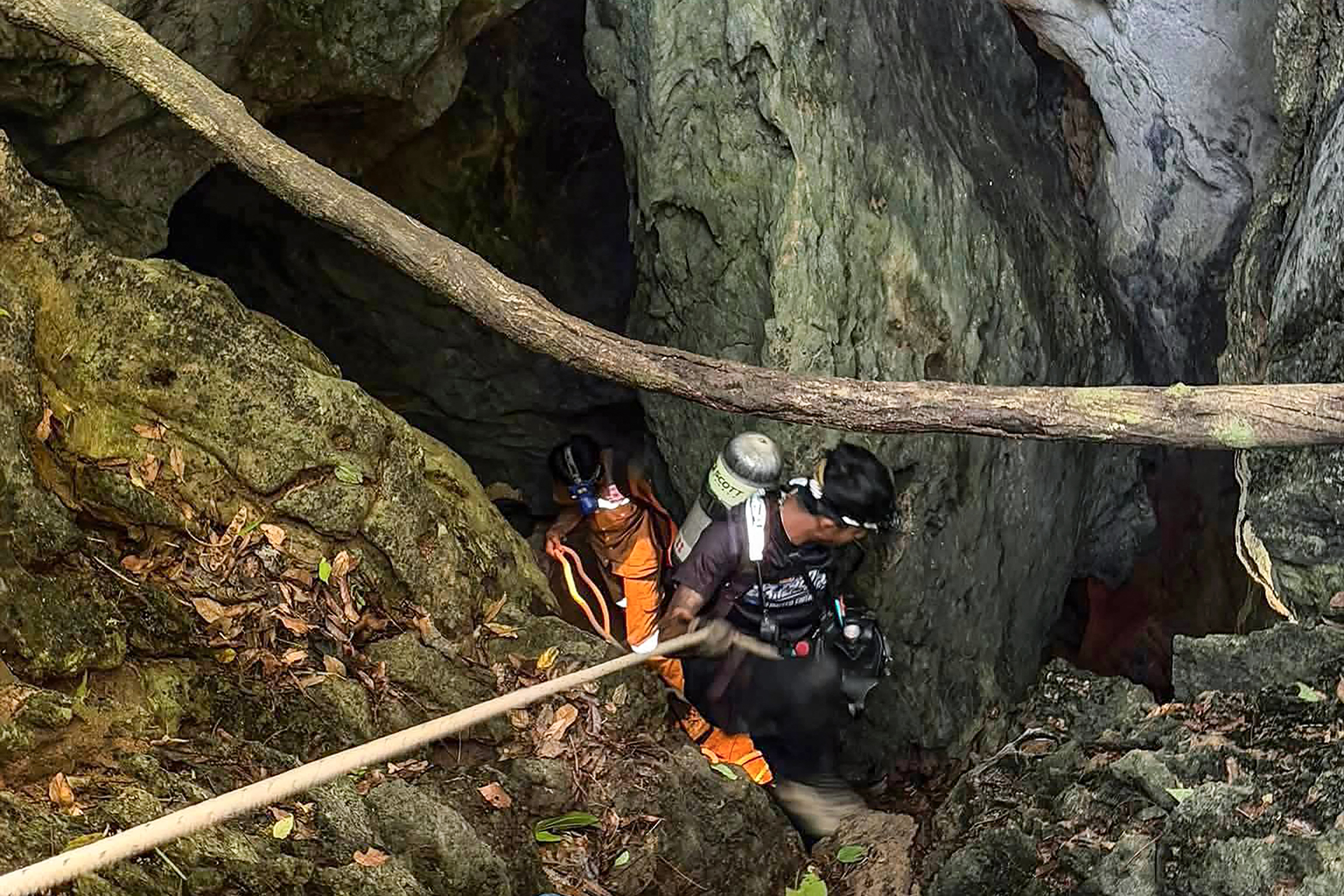 This handout image released by Metta Tham Rescue Kalasin on May 26, 2026 shows rescue workers inside a cave in Xaisomboun province.