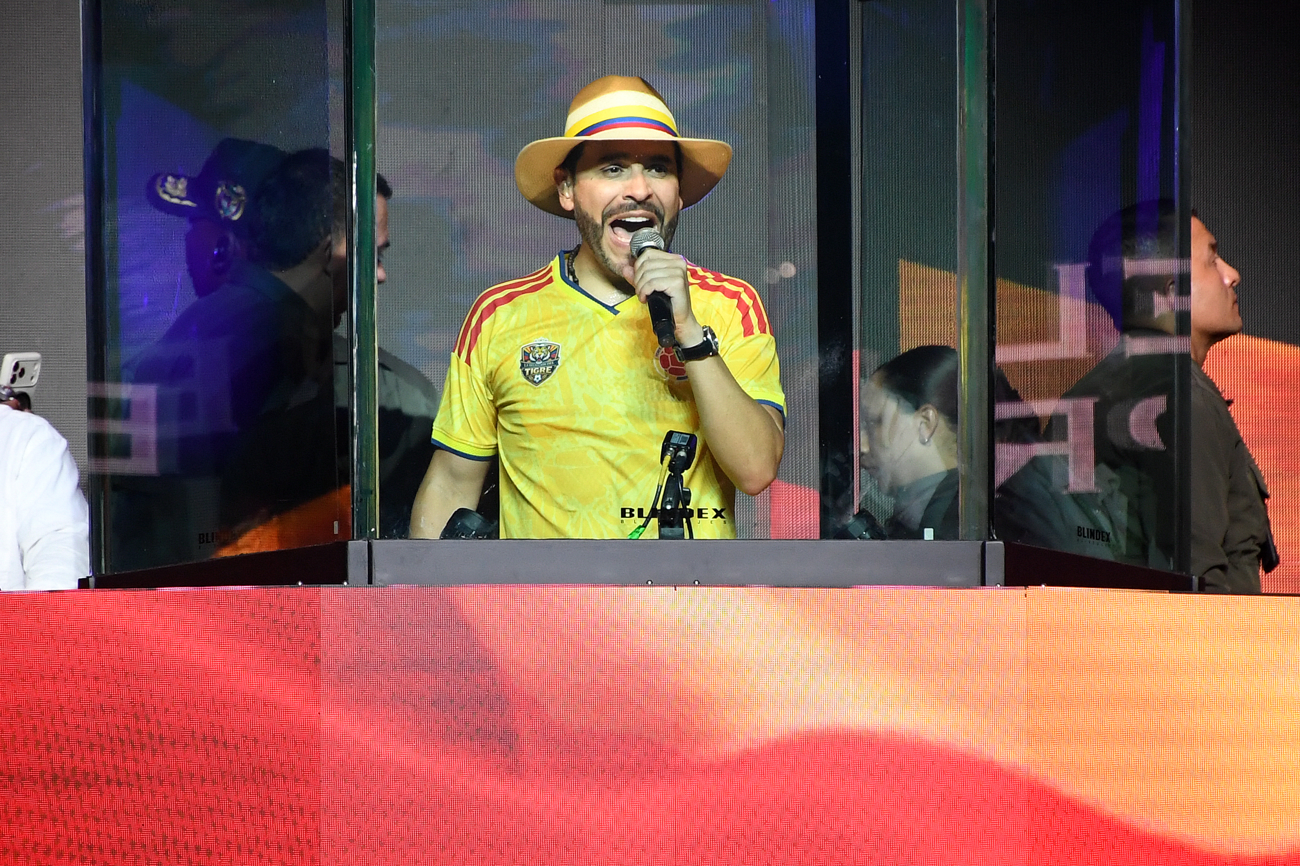 Colombia's presidential candidate Abelardo de la Espriella, of the Defensores de la Patria party, speaks behind bulletproof glass during his closing campaign rally in Medellin, Colombia on May 24, 2026.