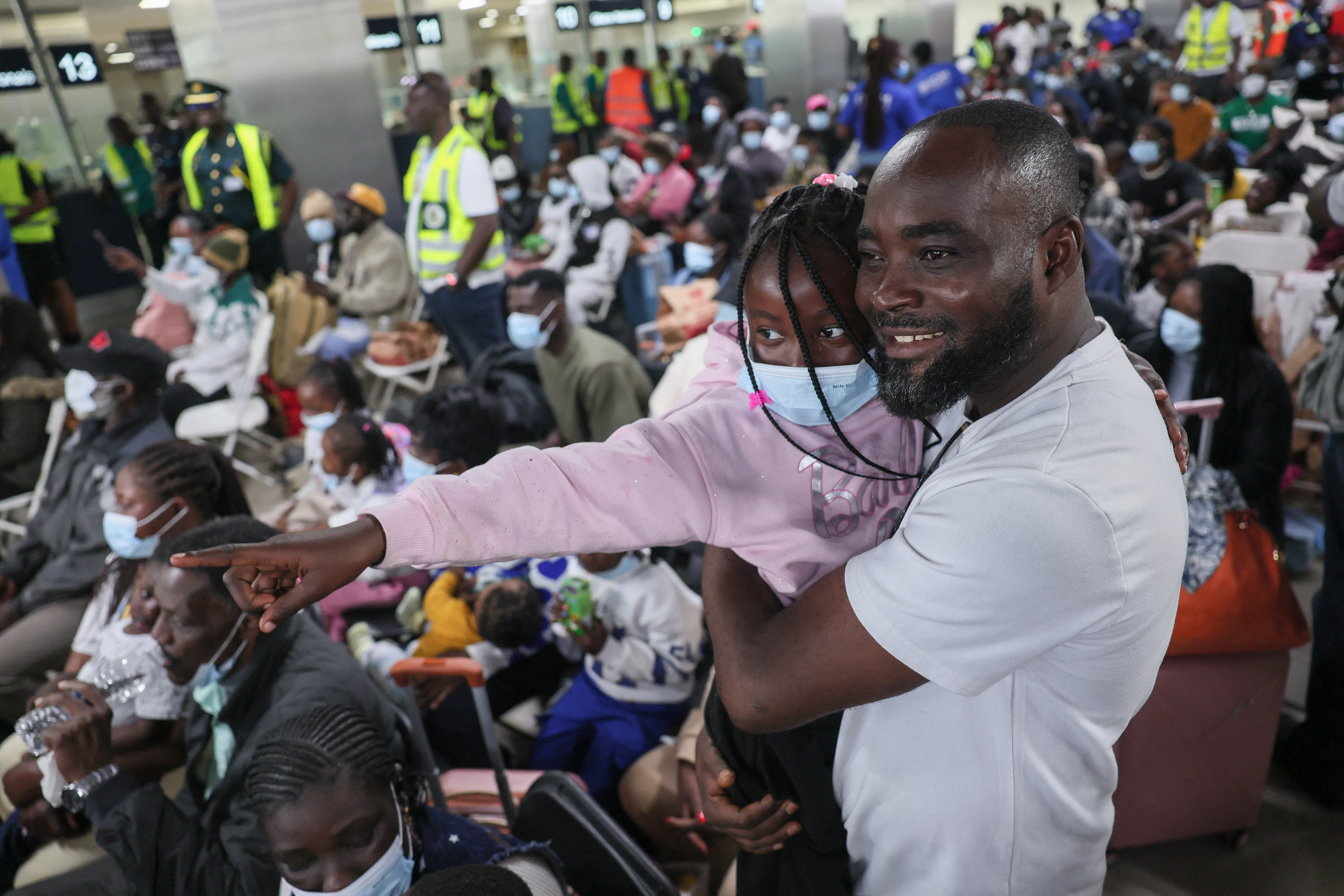 Ghanaian nationals evacuated from South Africa following xenophobia attacks react as they wait upon their arrival at Accra International Airport in Accra on May 27, 2026.