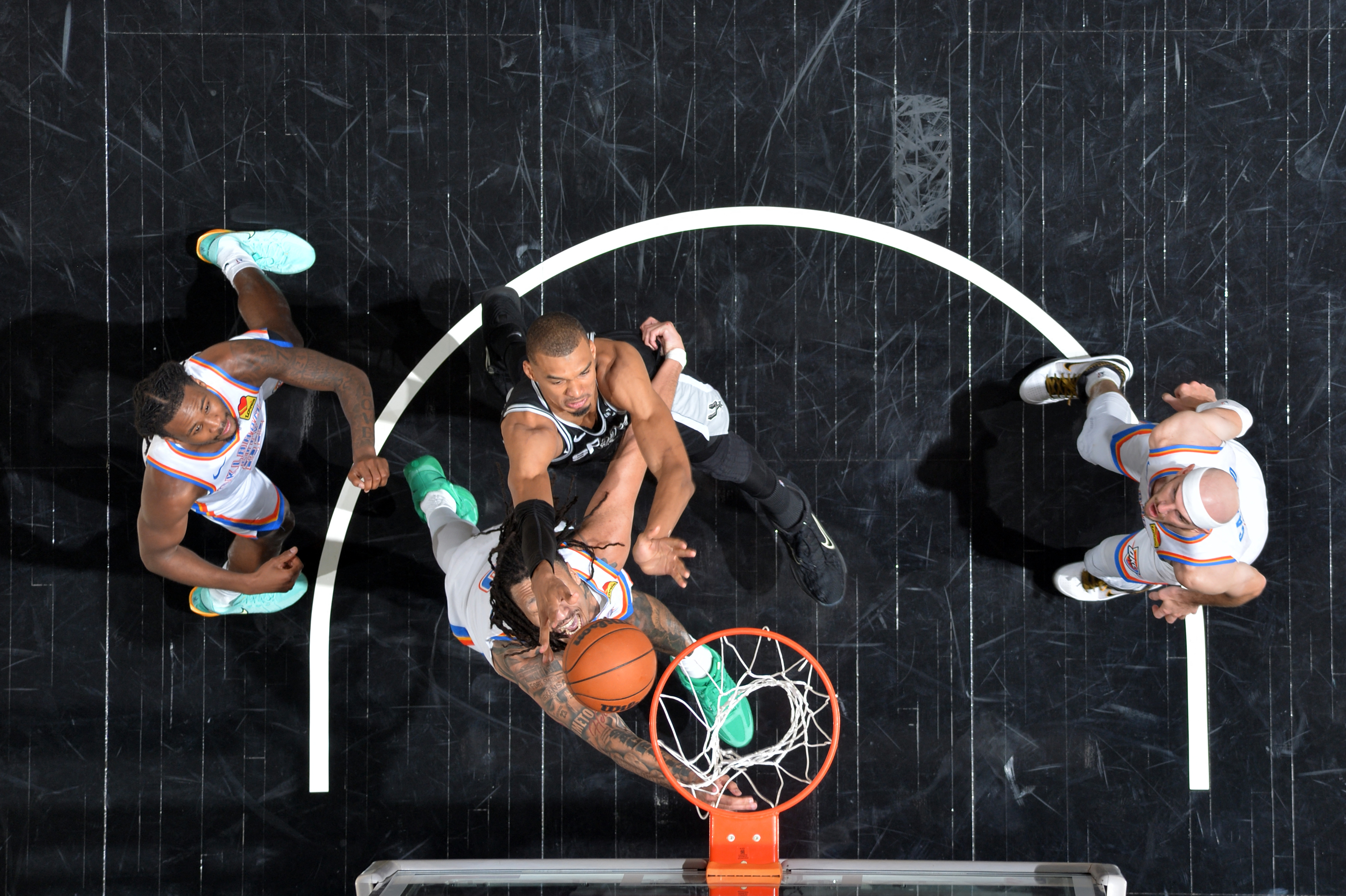 Victor Wembanyama #1 of the San Antonio Spurs drives to the basket during a game.