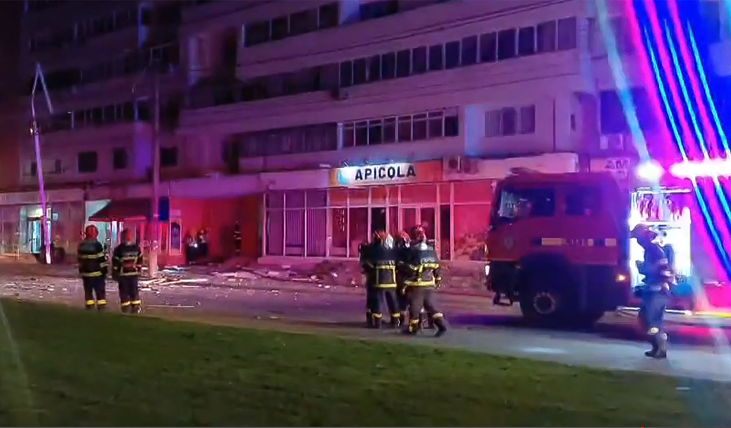 First responders in front of a building.