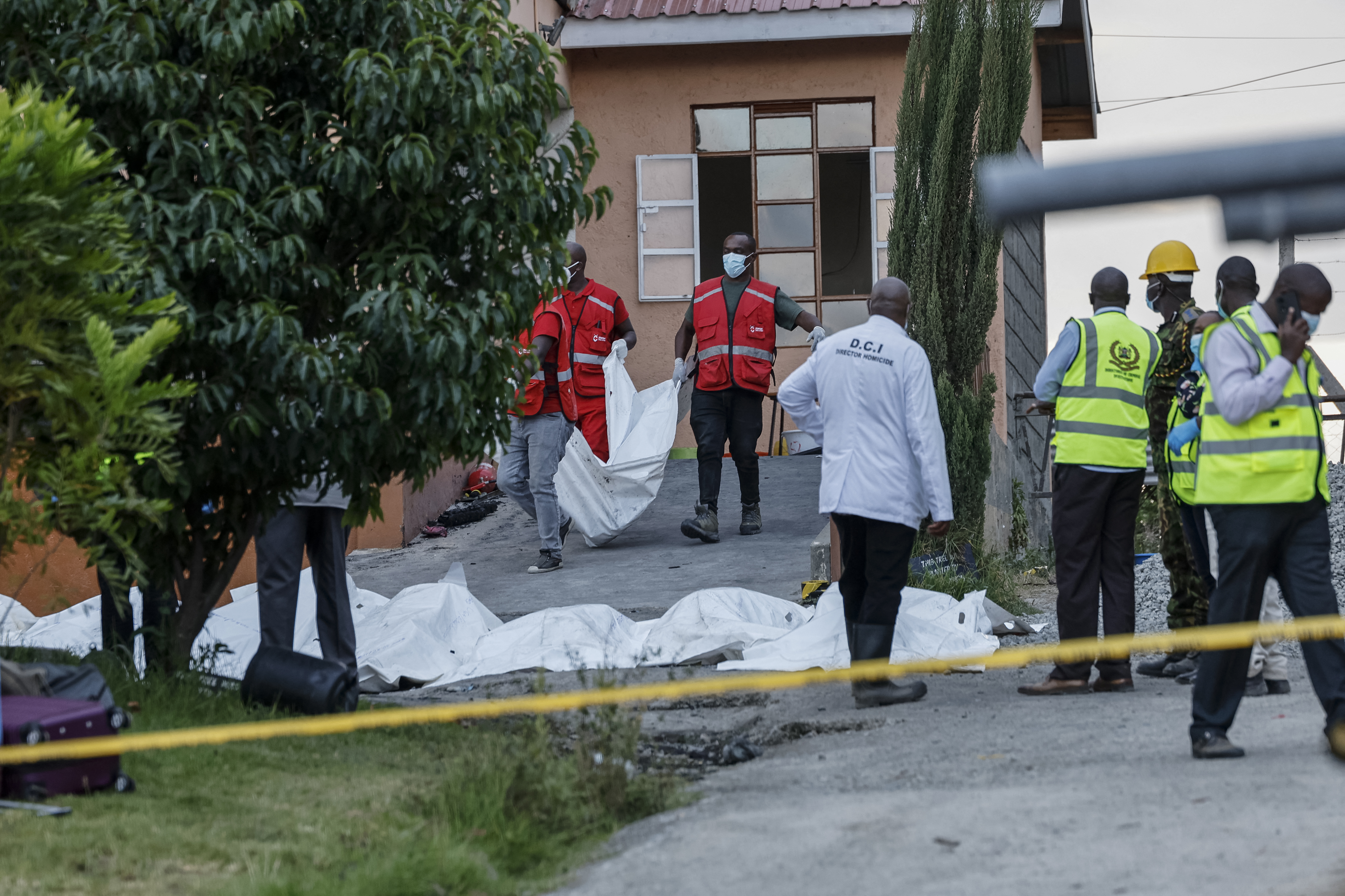 Kenya Red Cross workers retrieve one of the bodies at the Utumishi Girls Academy following the deadly fire in Gilgil, north of the capital Nairobi on May 28, 2026.