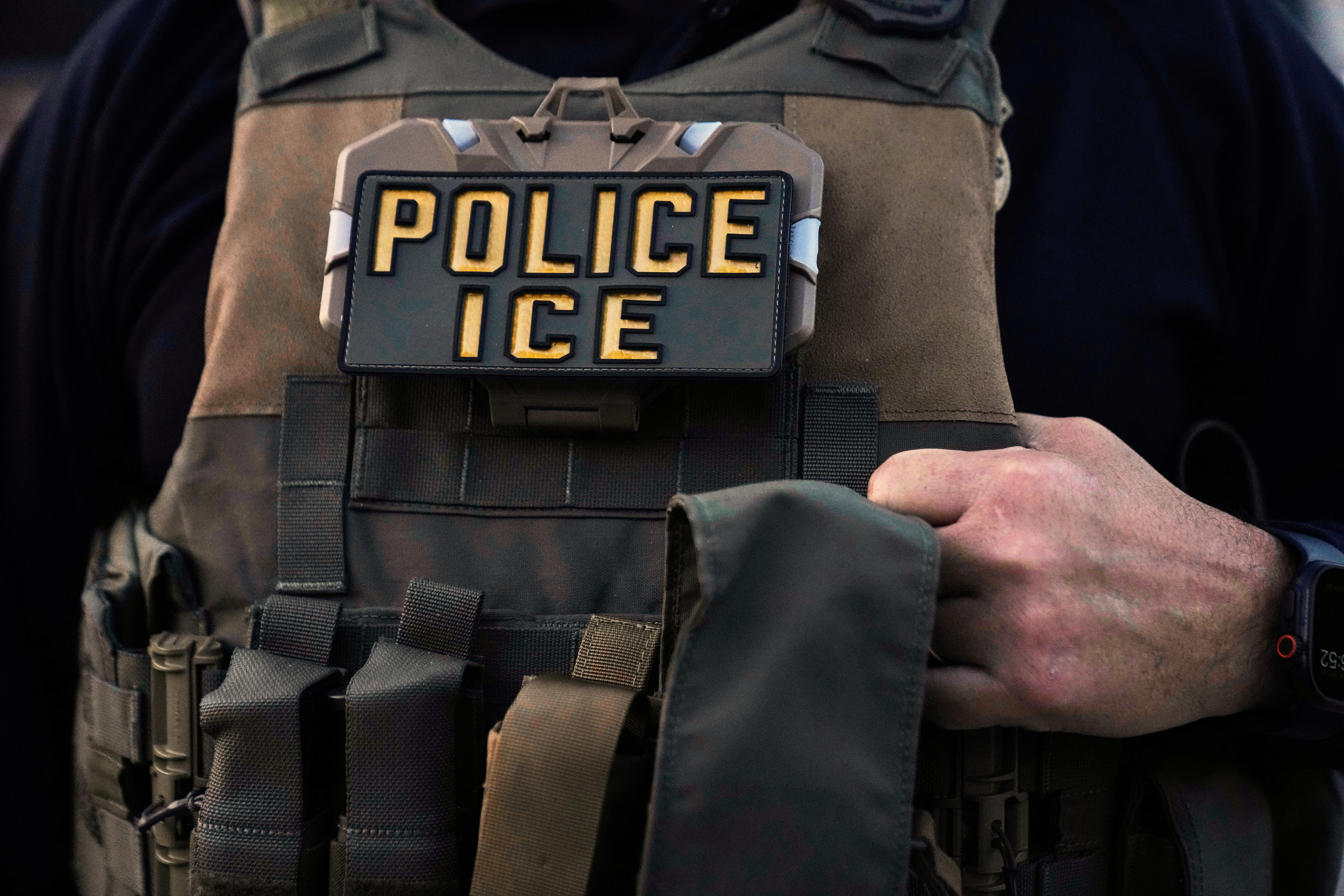 FILE - A U.S. Immigration and Customs Enforcement agent is seen in Park Ridge, Ill., Sept. 19, 2025. (AP Photo/Erin Hooley, File)