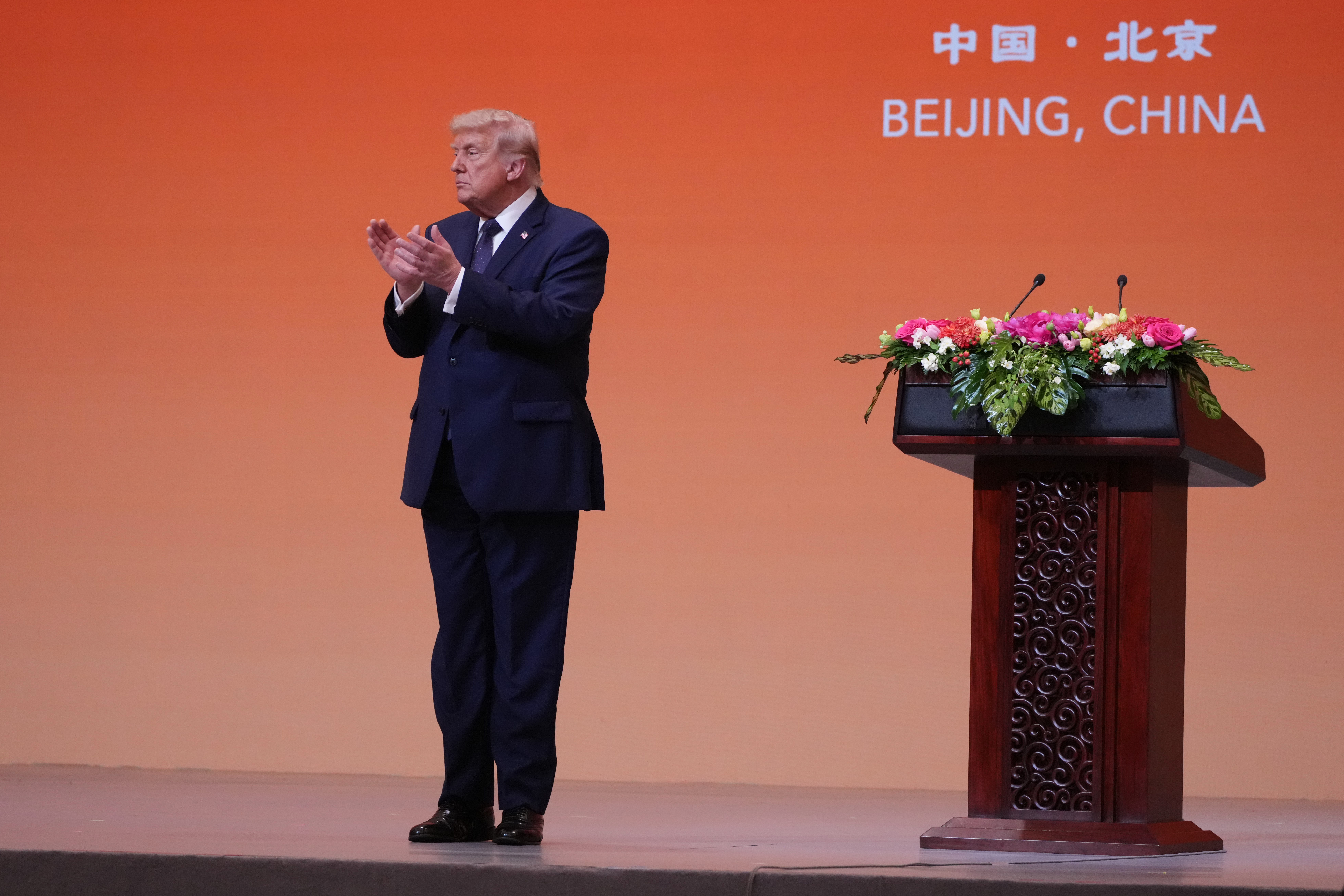 President Donald Trump applauds during a state dinner with China's President Xi Jinping at the Great Hall of the People on Thursday May 14, 2026, in Beijing. (AP Photo/Mark Schiefelbein)