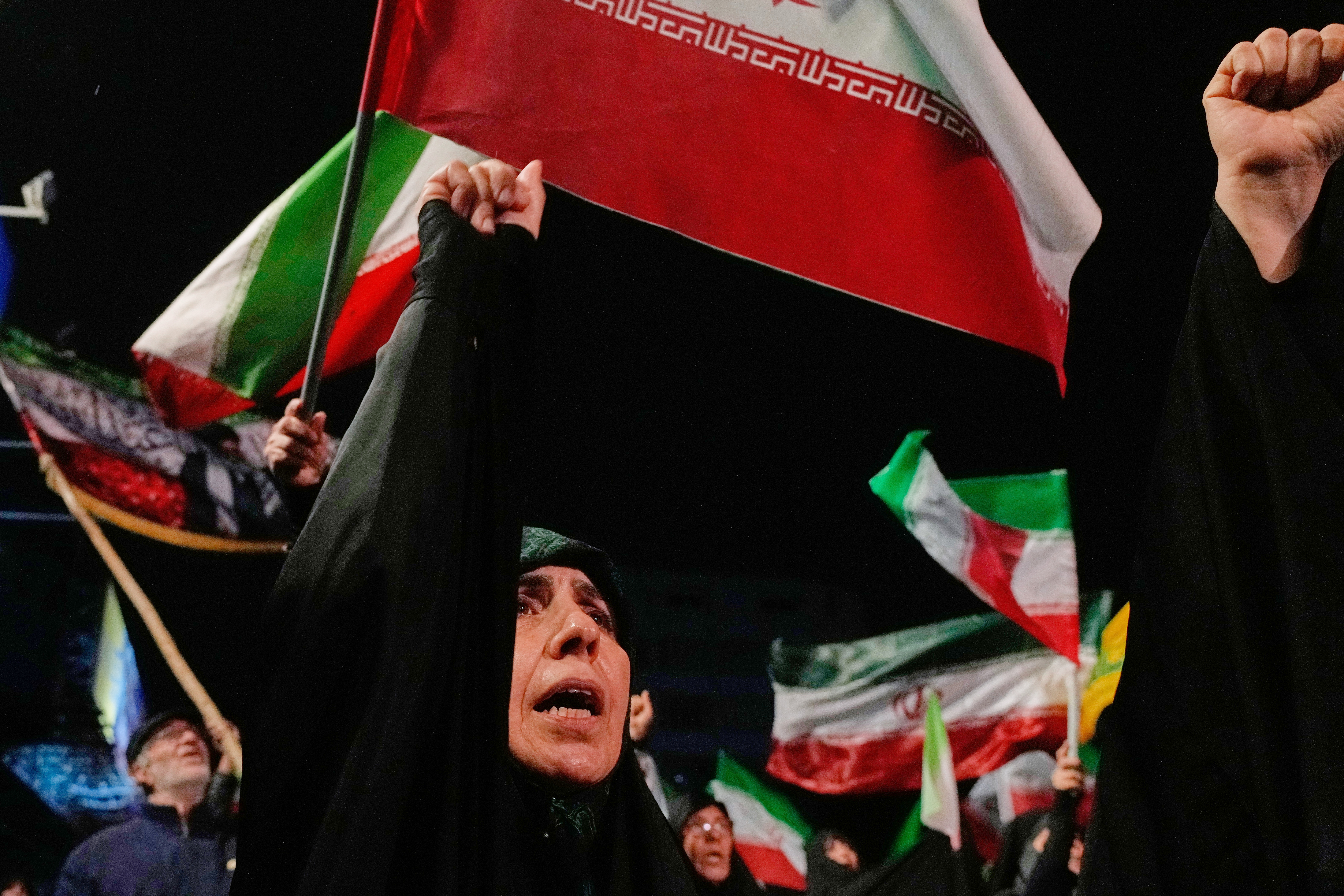 A demonstrator chants slogan during a pro-government gathering at a square in downtown Tehran, Iran, Tuesday, May 19, 2026. (AP Photo/Vahid Salemi)