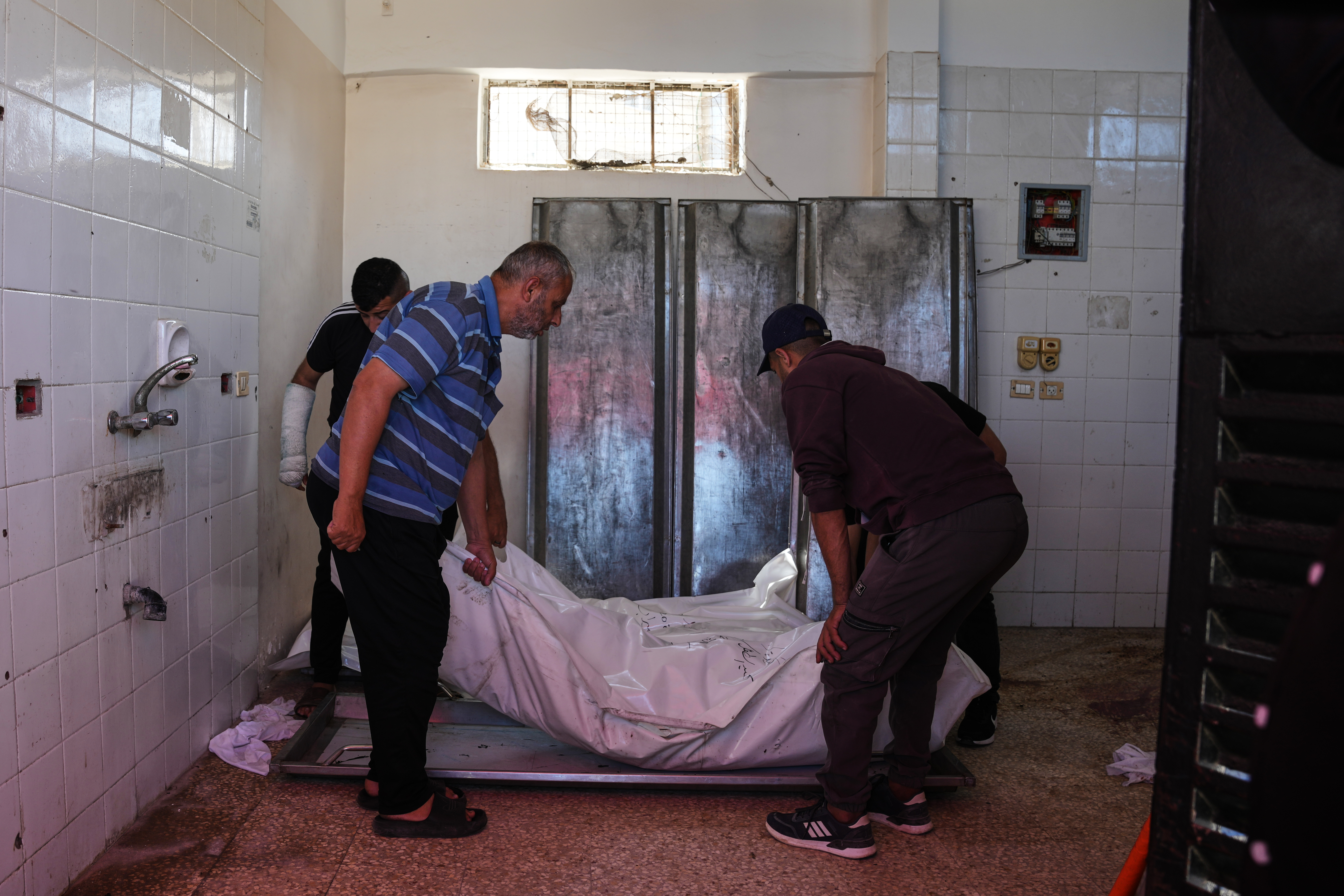 Palestinians carry the bodies of members of the Abu Malouh family during their funeral at Al-Aqsa Hospital in Deir al-Balah, Gaza Strip, Sunday, May 24, 2026, after they were killed in an Israeli airstrike. (AP Photo/Abdel Kareem Hana)