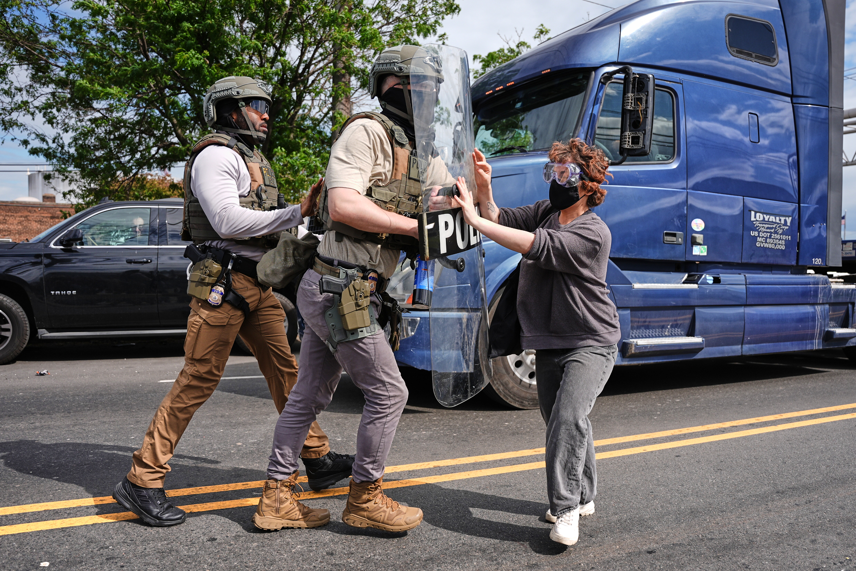 Federal immigration officers confront protesters outside the Delaney Hall detention center Thursday, May 28, 2026, in Newark, N.J. (AP Photo/Angelina Katsanis)