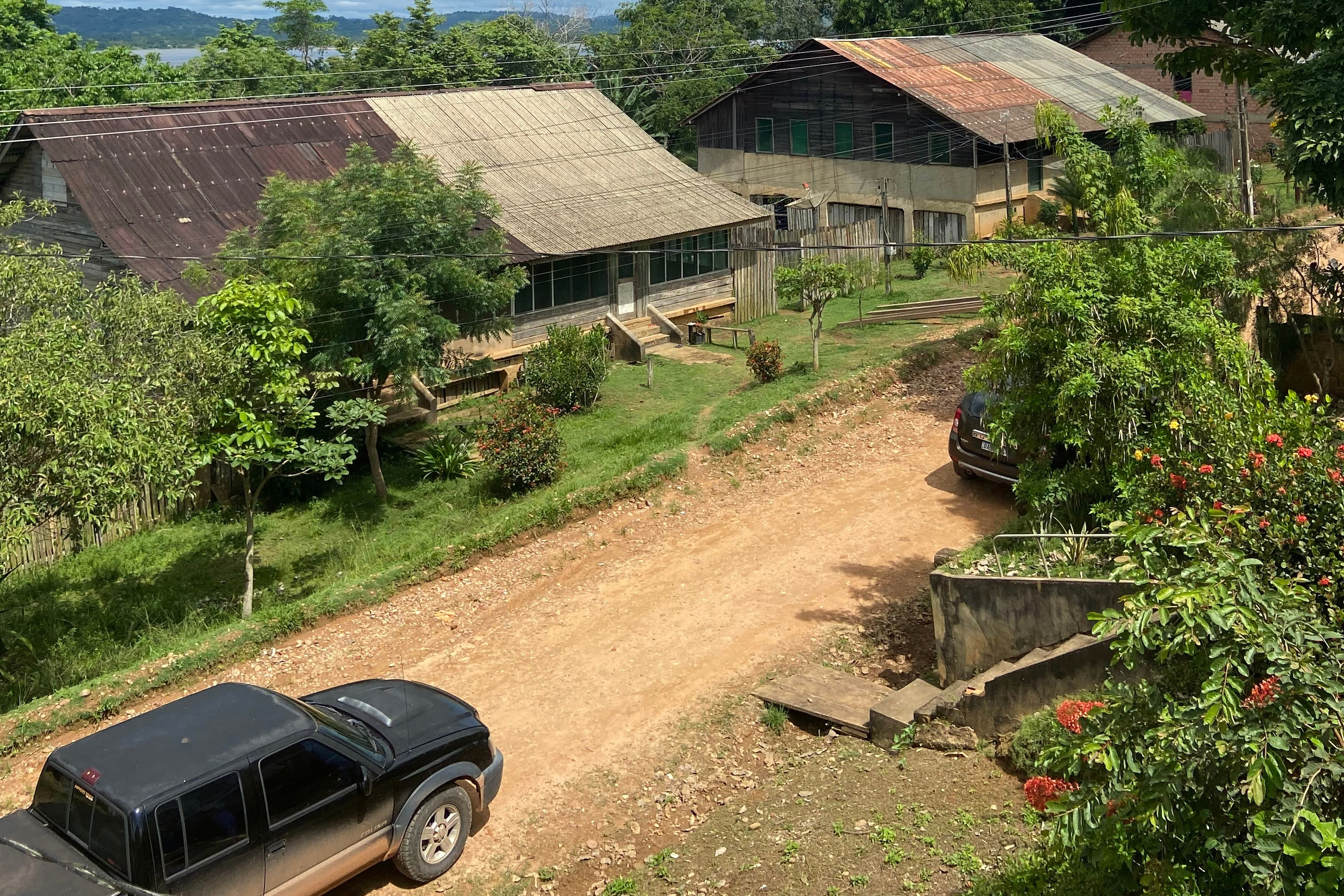 This photo provided by the Brazilian Federal Justice shows a truck driving past buildings in Fordlandia, Para, Brazil, Dec. 6, 2021. (Ianara Duarte/Brazilian Federal Justice via AP)