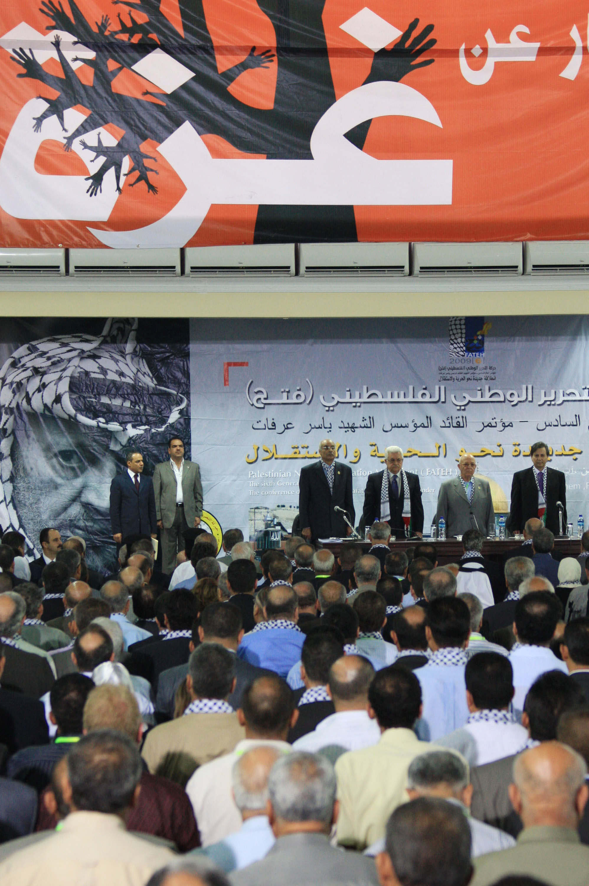 BETHLEHEM, WEST BANK - AUGUST 04: In this handout image provided by the Palestinian Press Office (PPO), Palestinian President and Fatah leader Mahmoud Abbas (3rd R) attends the opening of the three day Conference of Fatah on August 04, 2009 in Bethlehem, West Bank. Attended by over 2,000 delegates, the Fatah party opened its first congress in two decades, the sixth since the party was founded in 1958 by Yasser Arafat. (Photo by Thaer Ganaim/PPO via Getty Images)