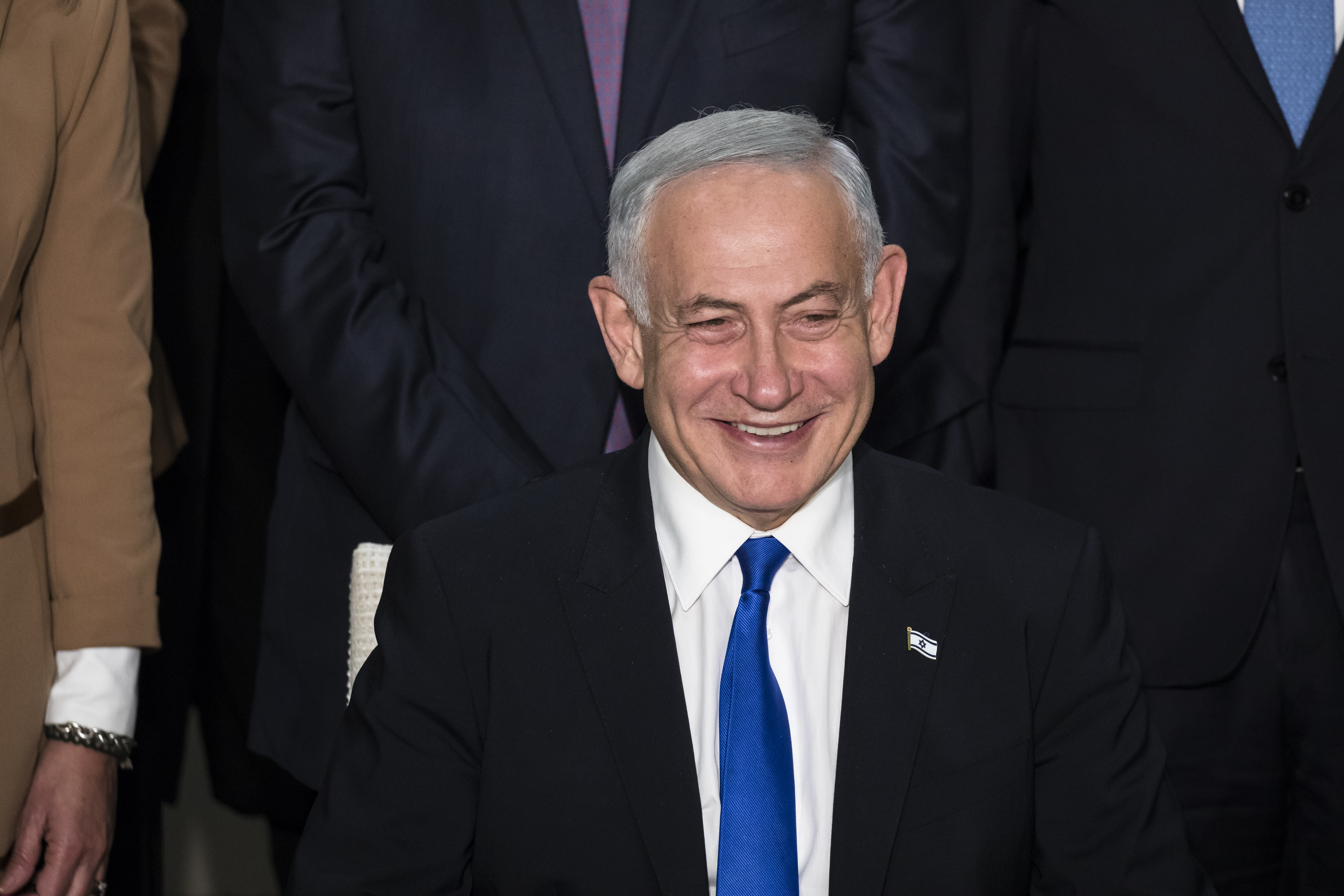 JERUSALEM, ISRAEL - DECEMBER 29: Israeli Prime Minister Benjamin Netanyahu smiles during a traditional government group photo at the President's house on December 29, 2022 in Jerusalem, Israel. Conservative Benjamin Netanyahu and a bloc of nationalist and religious parties won a clear election victory last month and will be sworn in as government to the Knesset today. This completes Netenyahu's political comeback with a record sixth term in office. (Photo by Amir Levy/Getty Images)