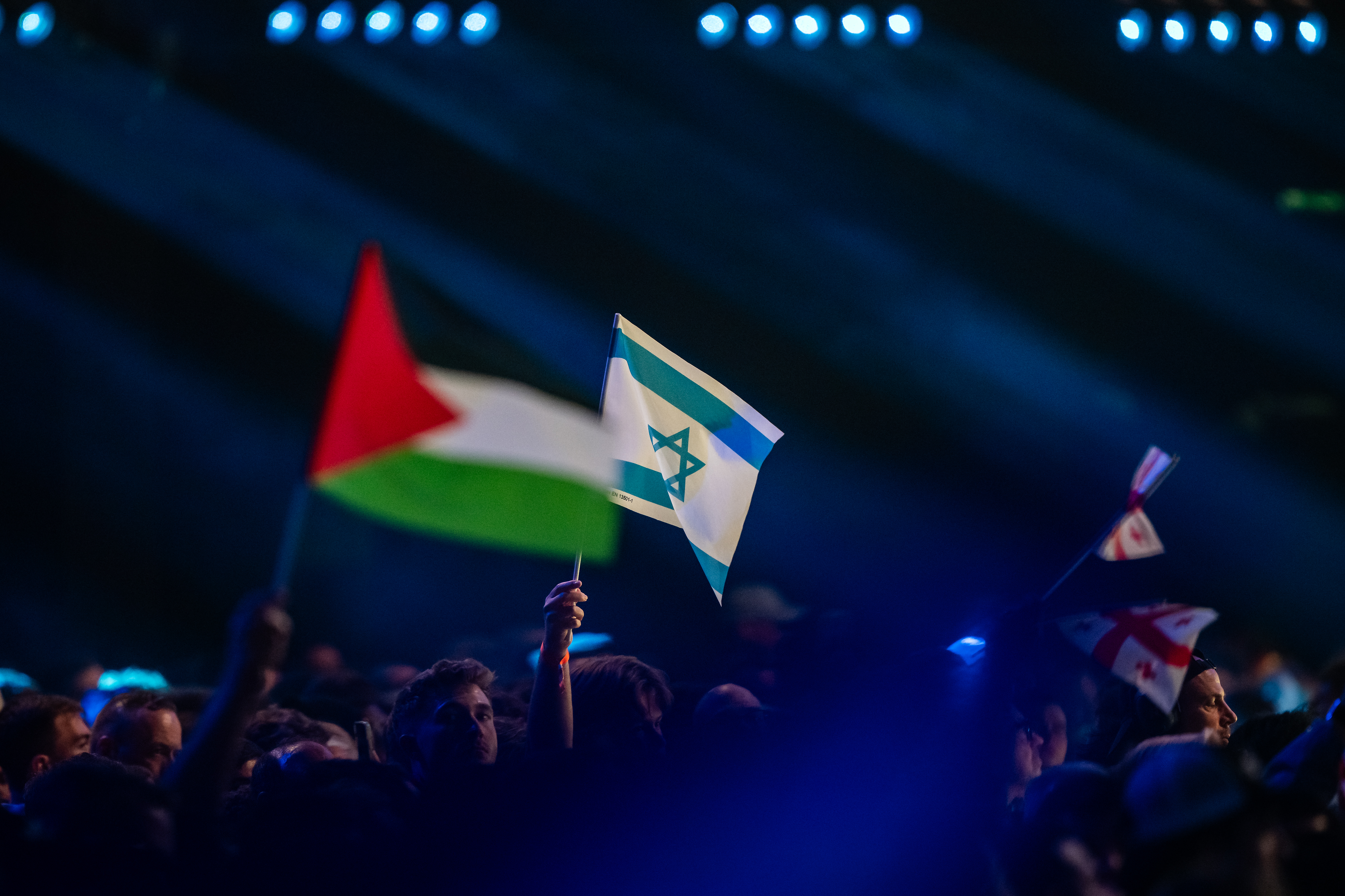 VIENNA, AUSTRIA - MAY 12: Spectators wave flags of Israel and Palestine during the first semi-final of the Eurovision Song Contest 2026 at Wiener Stadthalle on May 12, 2026 in Vienna, Austria. (Photo by Christian Bruna/Getty Images)
