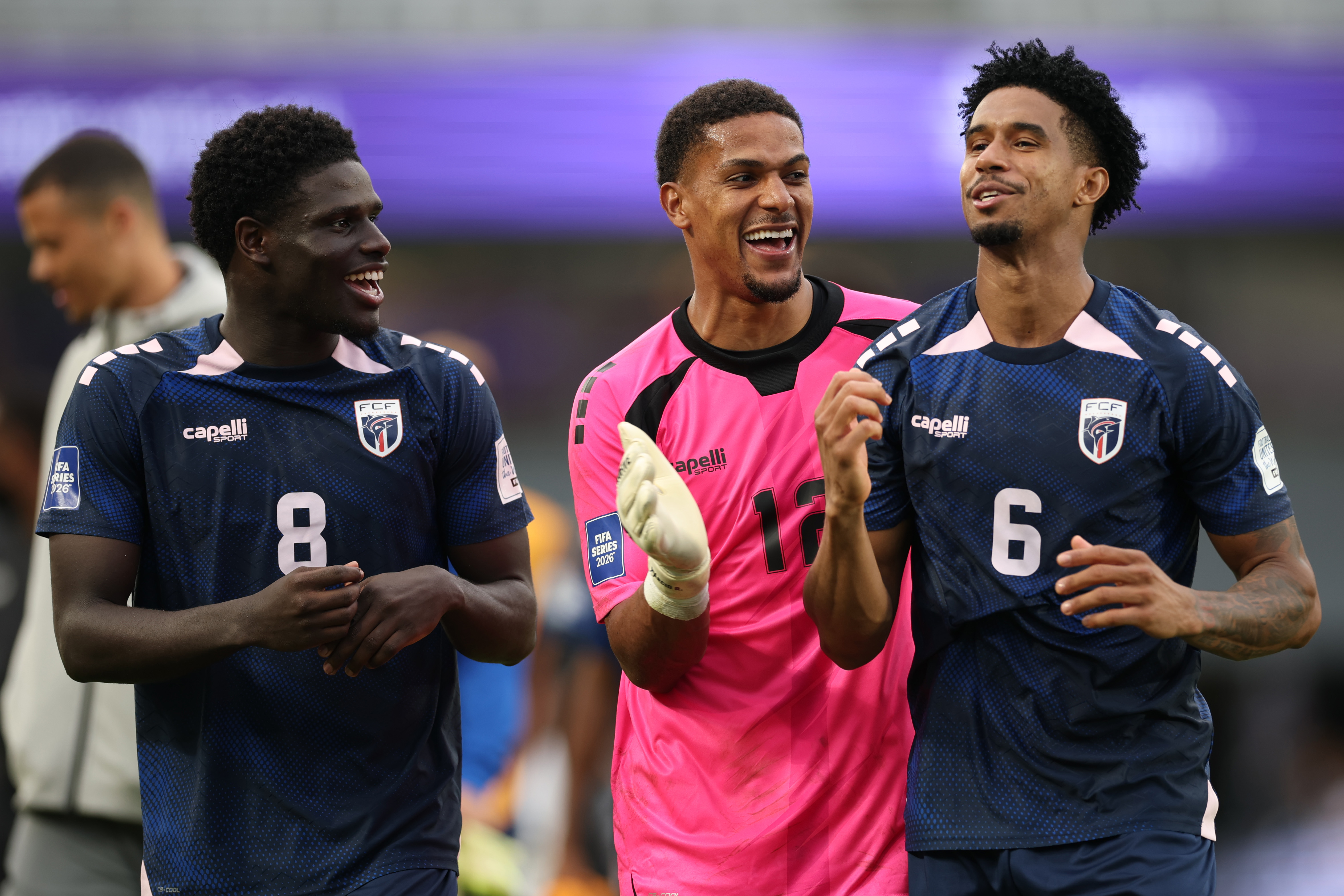 AUCKLAND, NEW ZEALAND - MARCH 30: João Paulo Fernandes of Cape Verde, Márcio Rosa of Cape Verde and Kevin Pina of Cape Verde celebrate winning the match on penalties 4-2 during the FIFA Series match between Cape Verde and Finland at Eden Park on March 30, 2026 in Auckland, New Zealand. (Photo by Phil Walter/Getty Images)