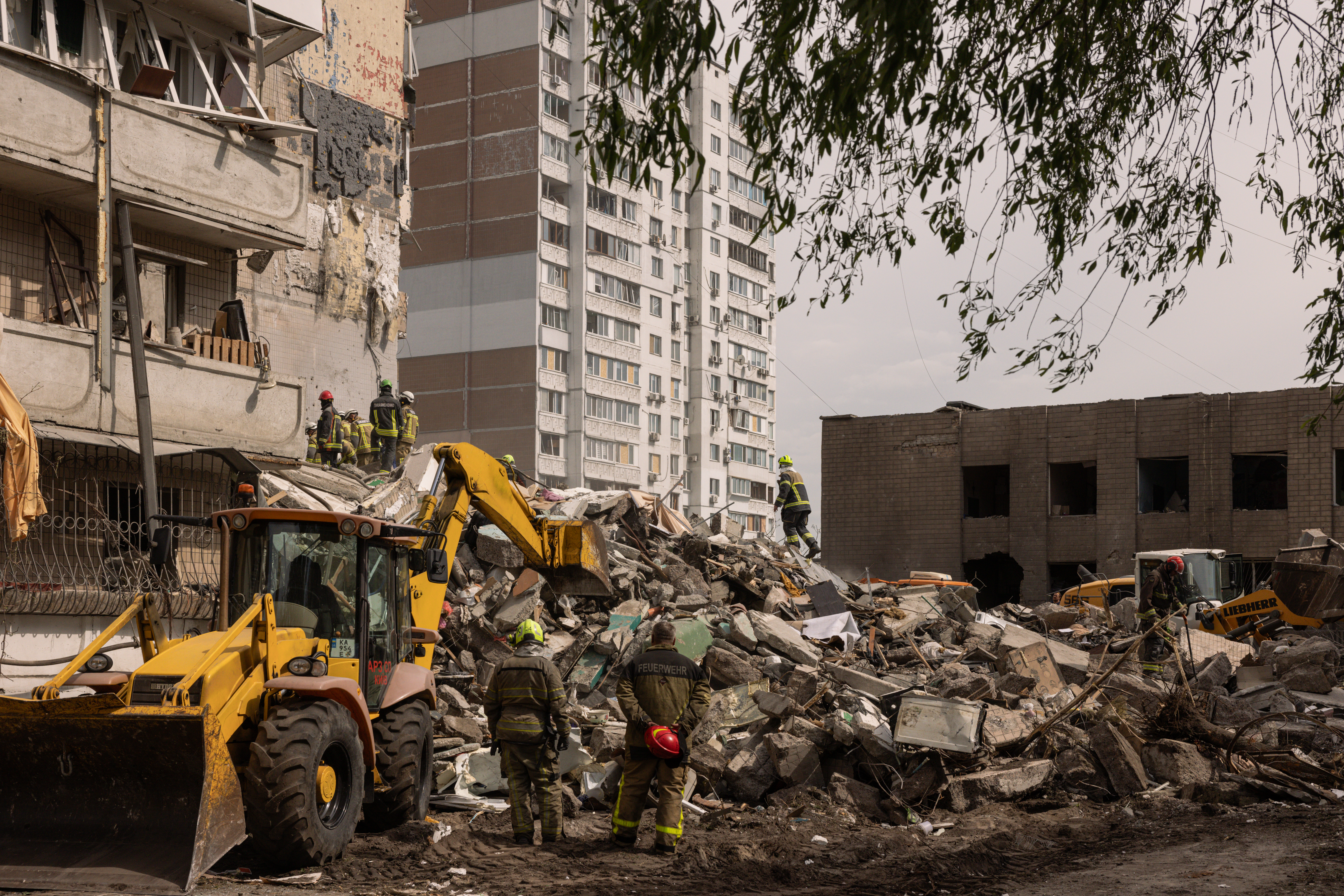 Emergency services search for missing people following a Russian missile and drone attack on May 14, 2026 in Kyiv, Ukraine