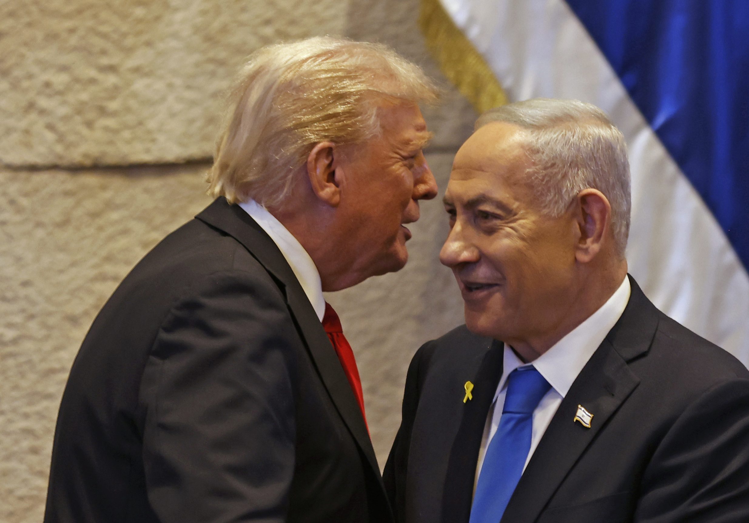 JERUSALEM - OCTOBER 13: U.S. President Donald Trump speaks with Israel's Prime Minister Benjamin Netanyahu in the Knesset, Israel's parliament, on October 13, 2025 in Jerusalem. President Trump is visiting the country hours after Hamas released the remaining Israeli hostages captured on Oct. 7, 2023, part of a US-brokered ceasefire deal to end the war in Gaza. (Photo by Jalaa Marey - Pool/Getty Images)