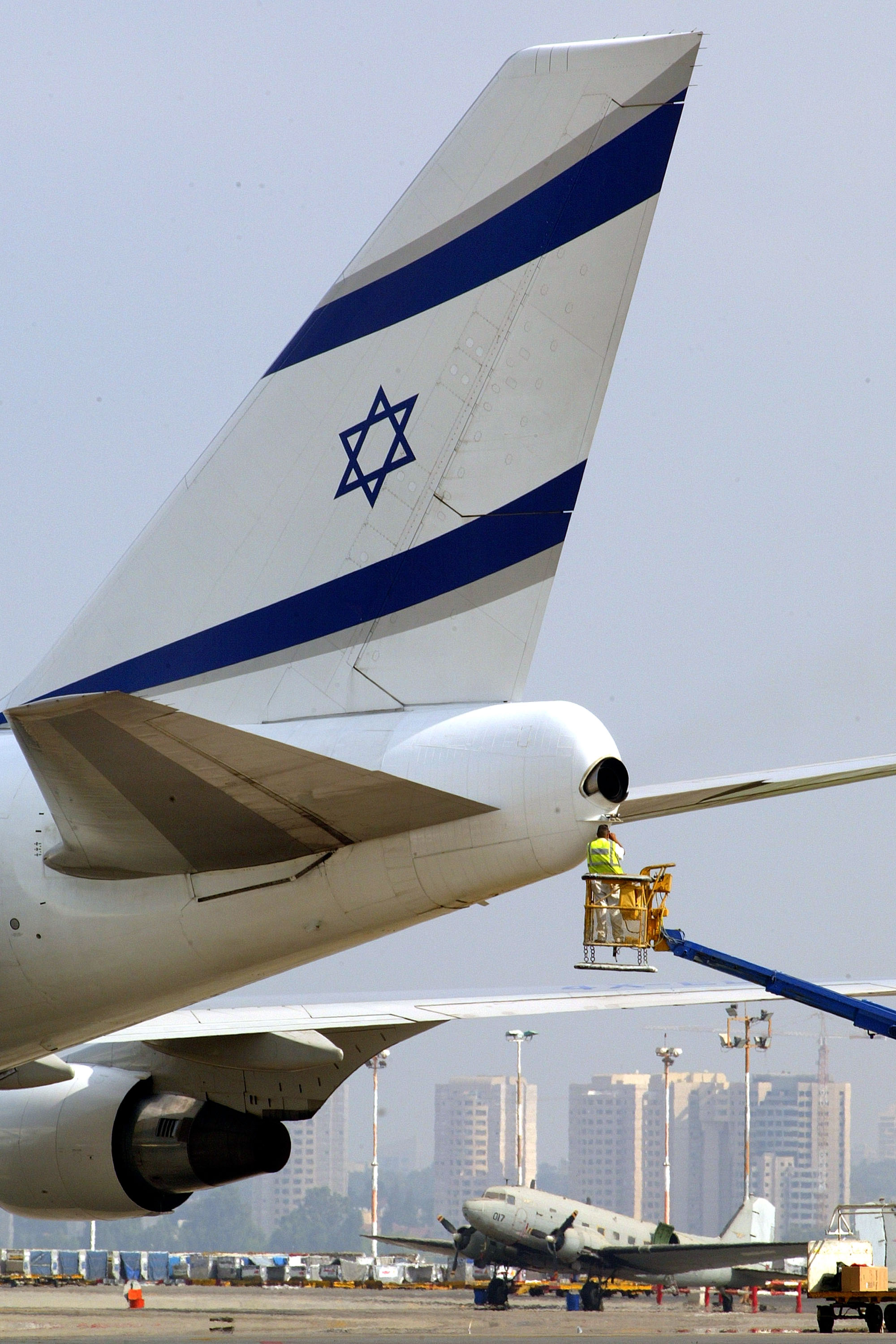 TEL AVIV, ISRAEL - JULY 9: An El Al passenger jet is inspected before take-off at Ben Gurion Airport July 9, 2003 near Tel Aviv, Israel. The Israeli government has begun to sell off all 100% of its stake in El Al, hoping to raise as much as US$150 million, about equal to what is owed in employee liabilities. (Photo by David Silverman/Getty Images)