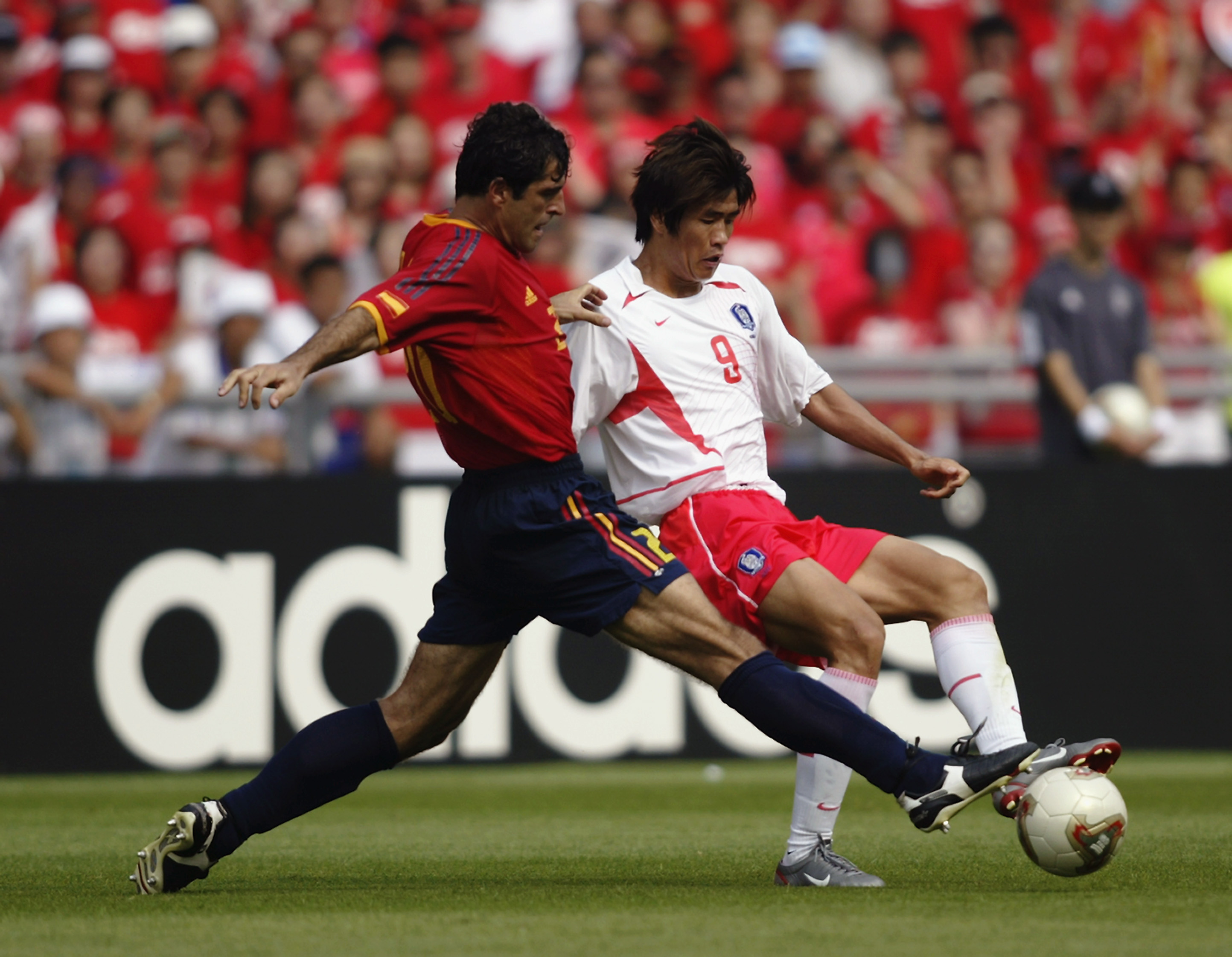 GWANGJU - JUNE 22: Ki Hyeon Seol of South Korea is tackled by Nadal of Spain during the FIFA World Cup Finals 2002 Quarter Finals match played at the Gwangju World Cup Stadium, in Gwangju, South Korea on June 22, 2002. The match ended in a 0-0 draw after extra-time, with South Korea winning on penalties 5-3. DIGITAL IMAGE. (Photo by Gary M. Prior/Getty Images)
