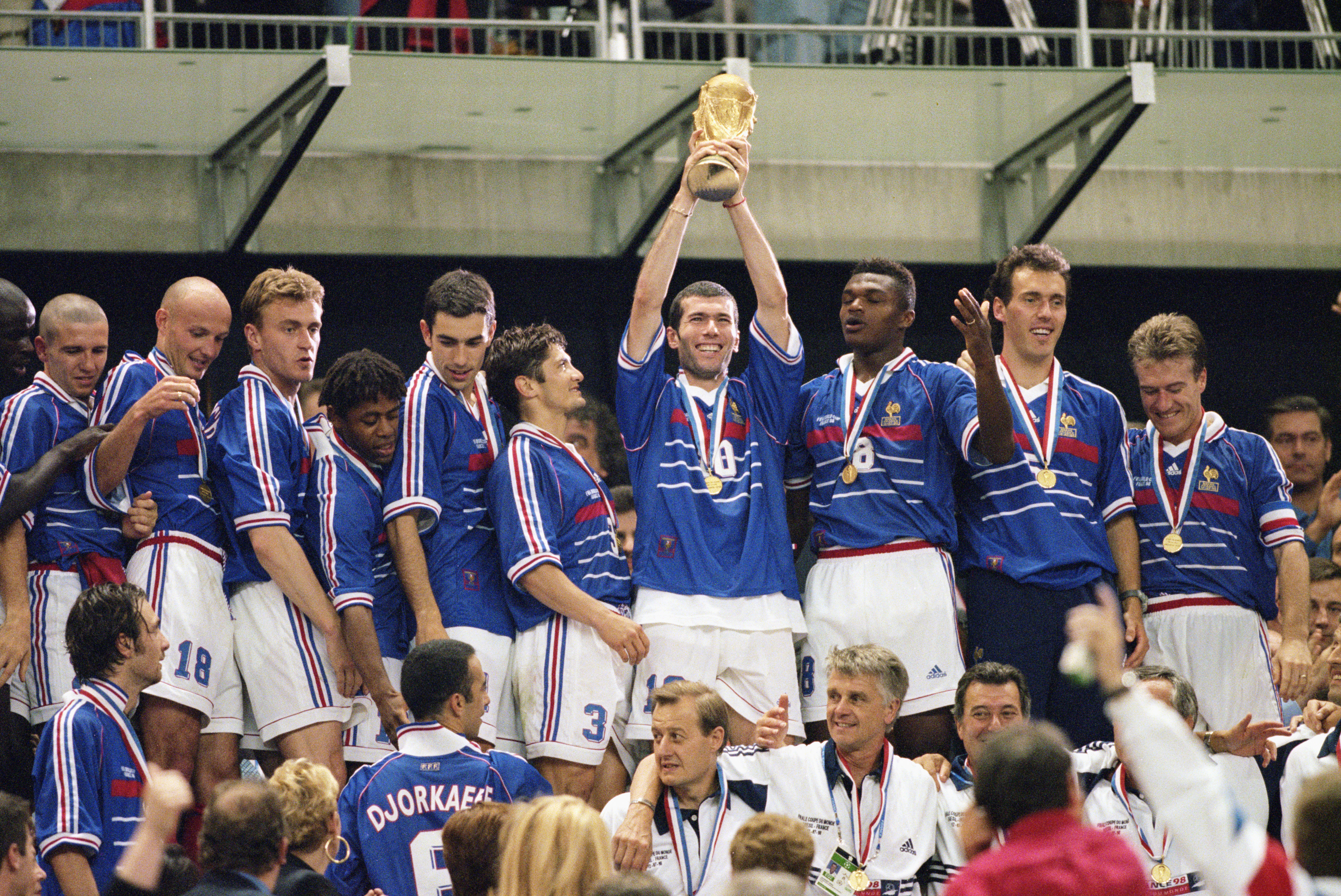 12 Jul 1998: Joy for France as match winnner Zinedine Zidane lifts the trophy after victory in the World Cup Final against Brazil at the Stade de France in St Denis. Zidane scored twice as France won 3-0. Mandatory Credit: Ben Radford /Allsport