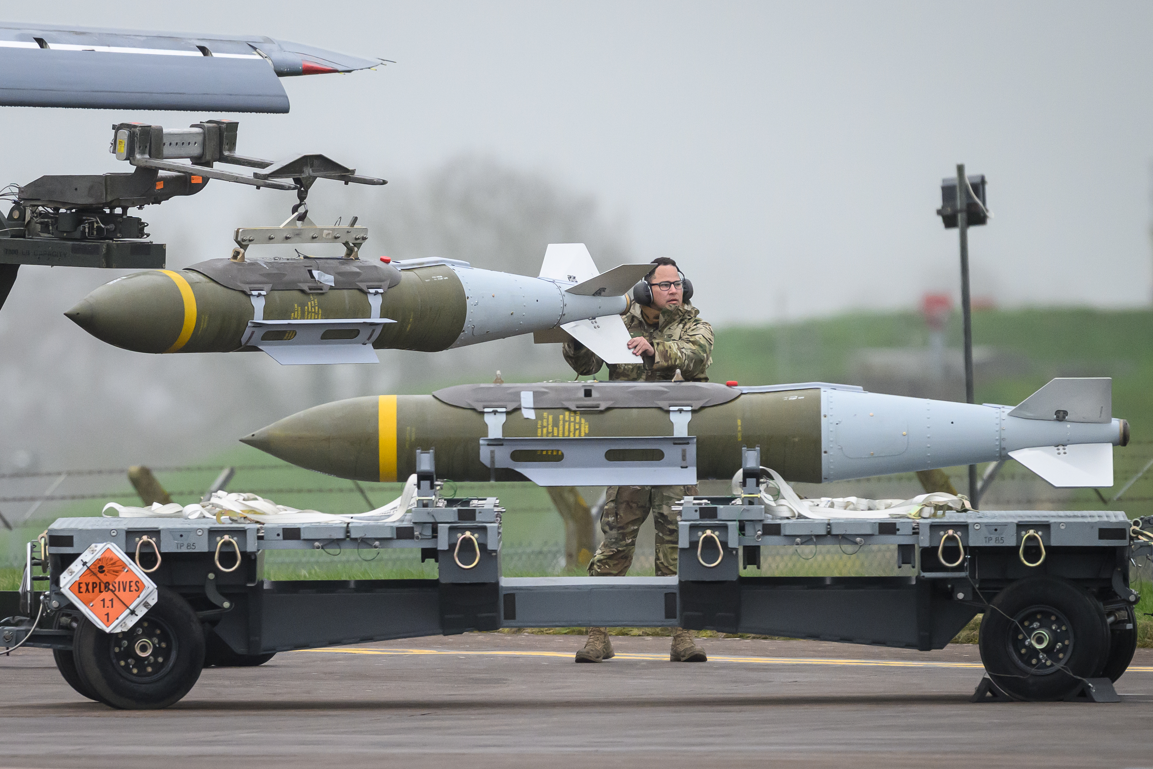 FAIRFORD, ENGLAND - MARCH 16: Ground crew move JDAM precision-guided munitions before they are loaded into a Rockwell B1 Lancer heavy bomber at RAF Fairford on March 16, 2026 in Fairford, England. Since UK Prime Minister Keir Starmer back-tracked on his initial refusal to allow the U.S. to use British bases to launch defensive strikes against Iranian missile sites, a variety of U.S. military aircraft, including B52 and B-1 bombers, have been spotted at RAF Fairford in Gloucestershire. (Photo by Leon Neal/Getty Images)