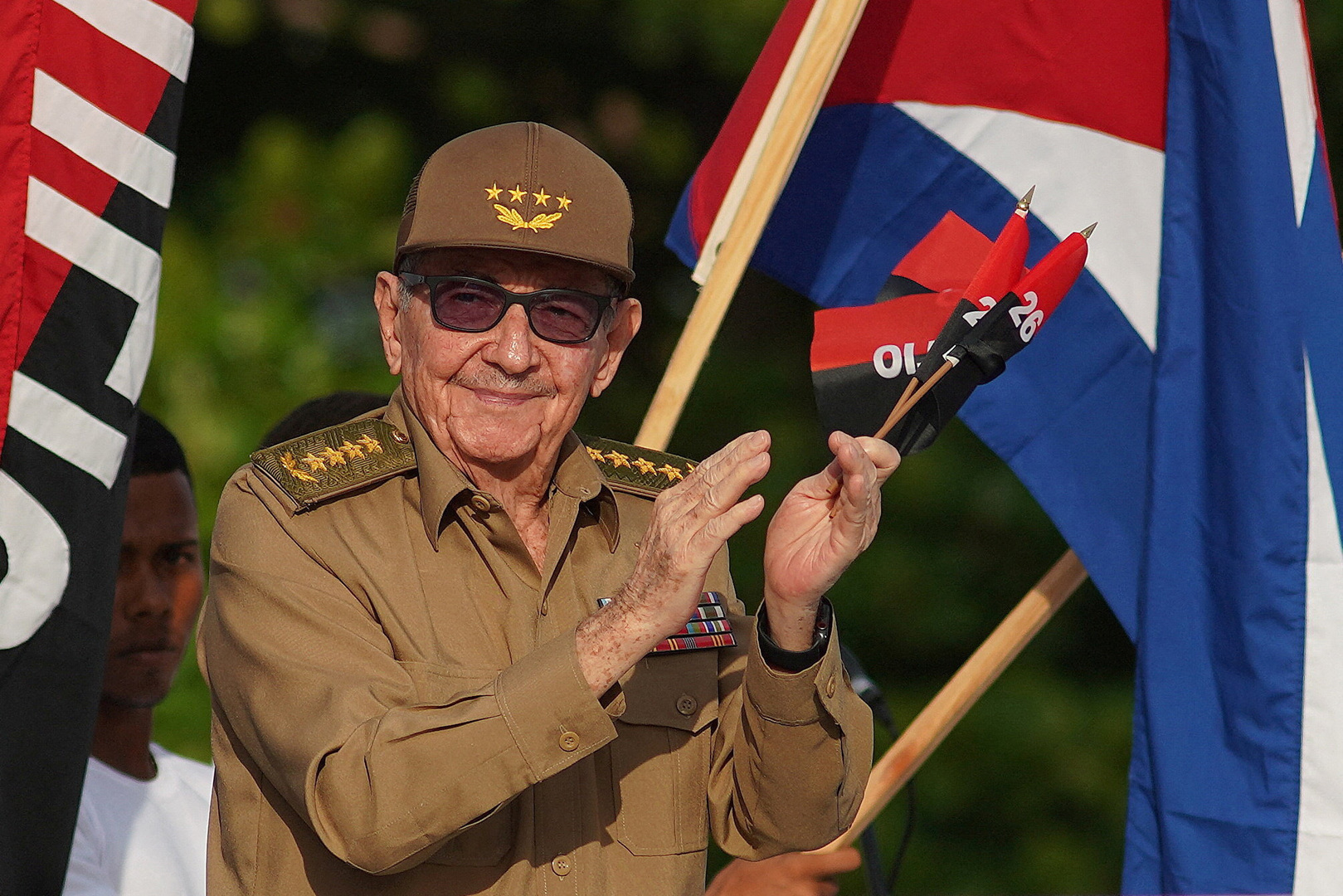 Cuba's former President Raul Castro claps during a ceremony marking the 69th anniversary of the July 26, 1953 rebel assault which late Cuban leader Fidel Castro led on the Moncada army barracks, in Cienfuegos, Cuba, July 26, 2022. [Alexandre Meneghini/Reuters]