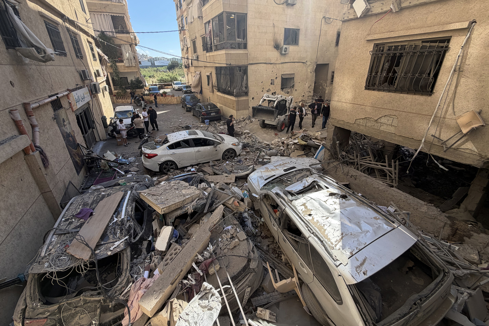 People clear the debris at the site of an Israeli strike on Beirut's southern suburbs, Lebanon on May 28, 2026. [Raghed Waked/Reuters]