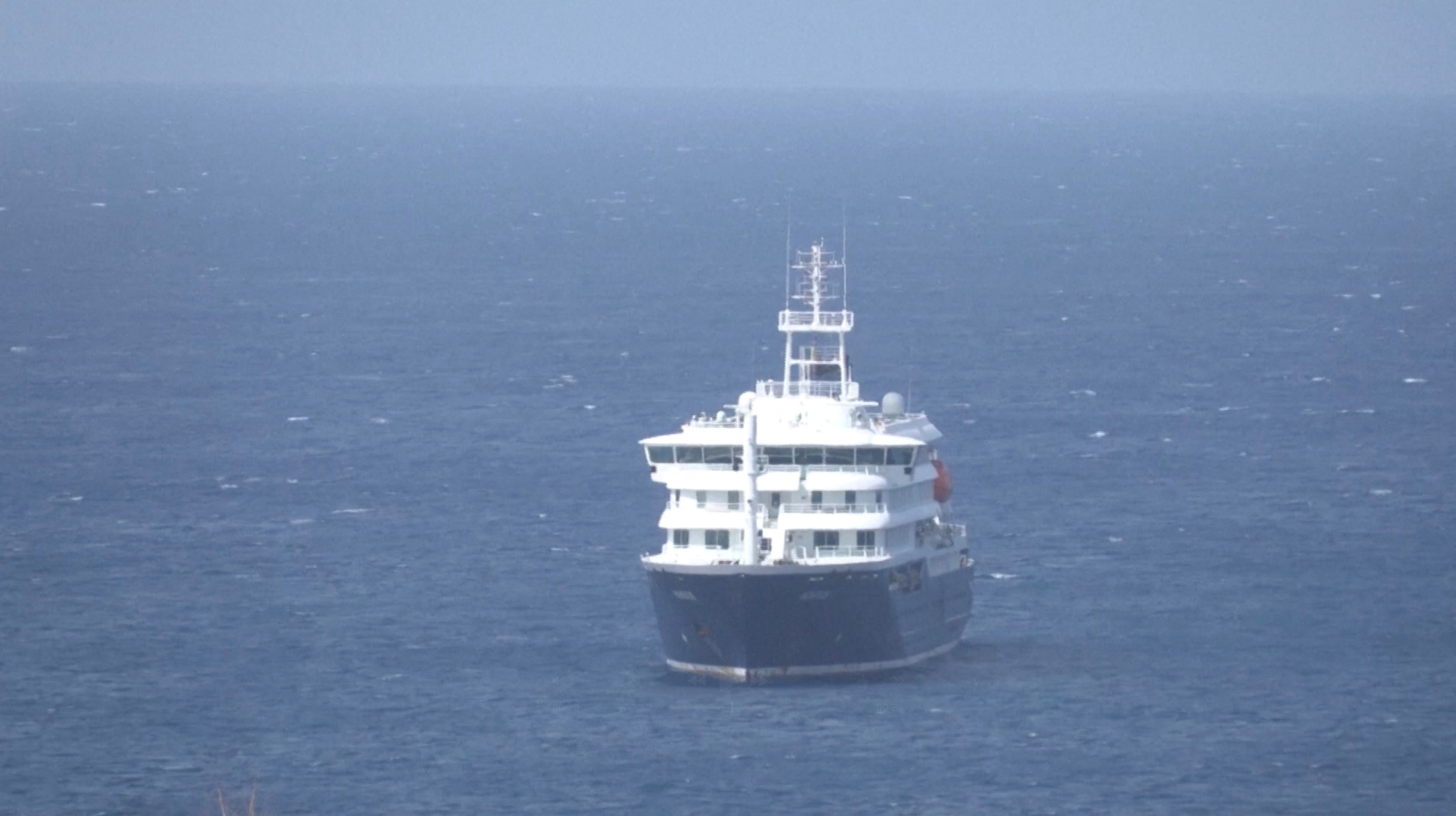 Cruise ship MV Hondius docks off Cape Verde port, as passengers were not allowed off the ship, while health authorities investigated suspected cases of hantavirus aboard the vessel, in Praia Port, Cape Verde, in this screengrab obtained from a video, May 4, 2026. REUTERS TV via REUTERS