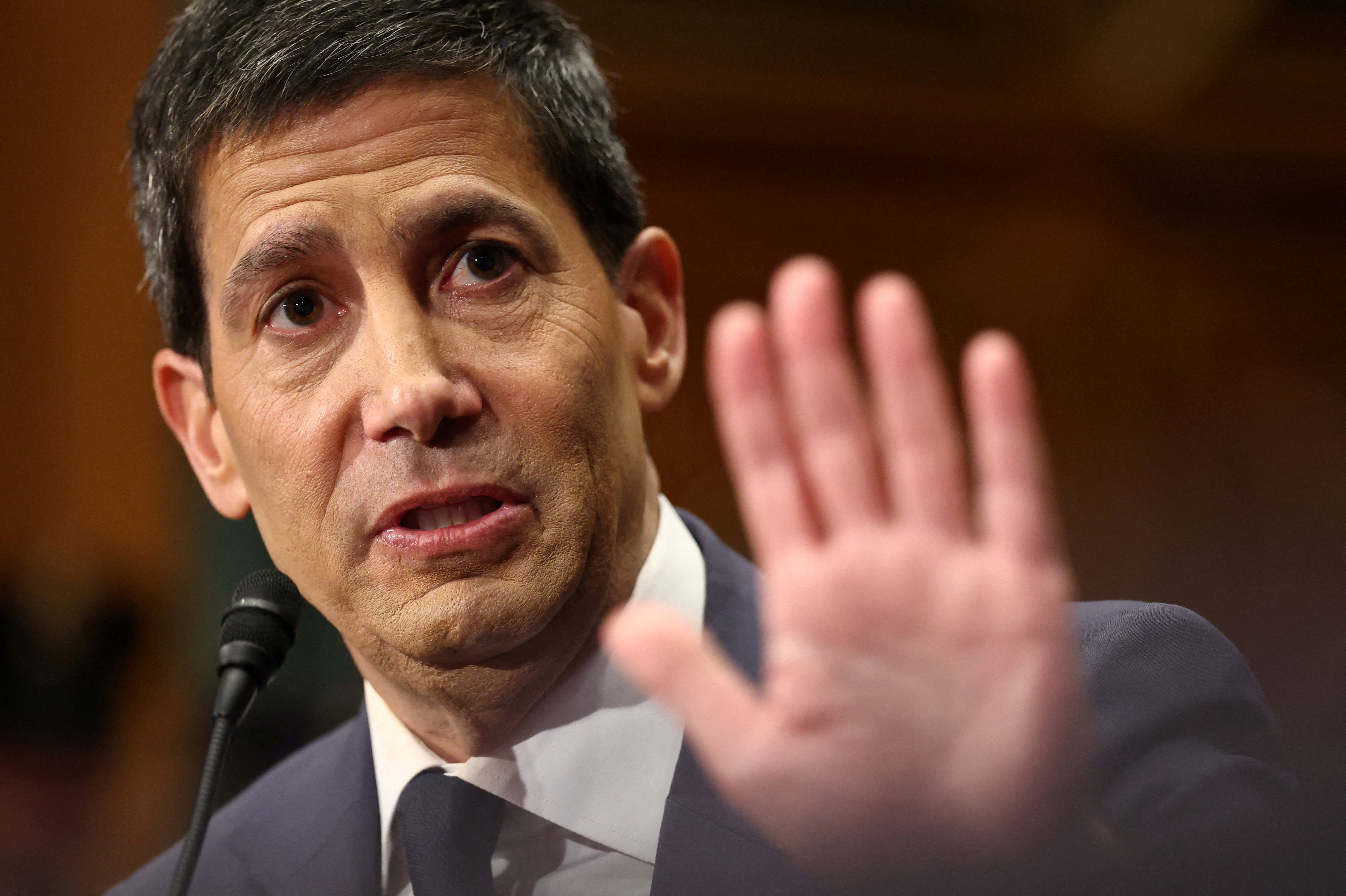 FILE PHOTO: Kevin Warsh, U.S. President Donald Trump's nominee to be next chair of the Federal Reserve, testifies before a Senate Banking Committee confirmation hearing on Capitol Hill in Washington, D.C., U.S., April 21, 2026. REUTERS/Kevin Lamarque/File Photo