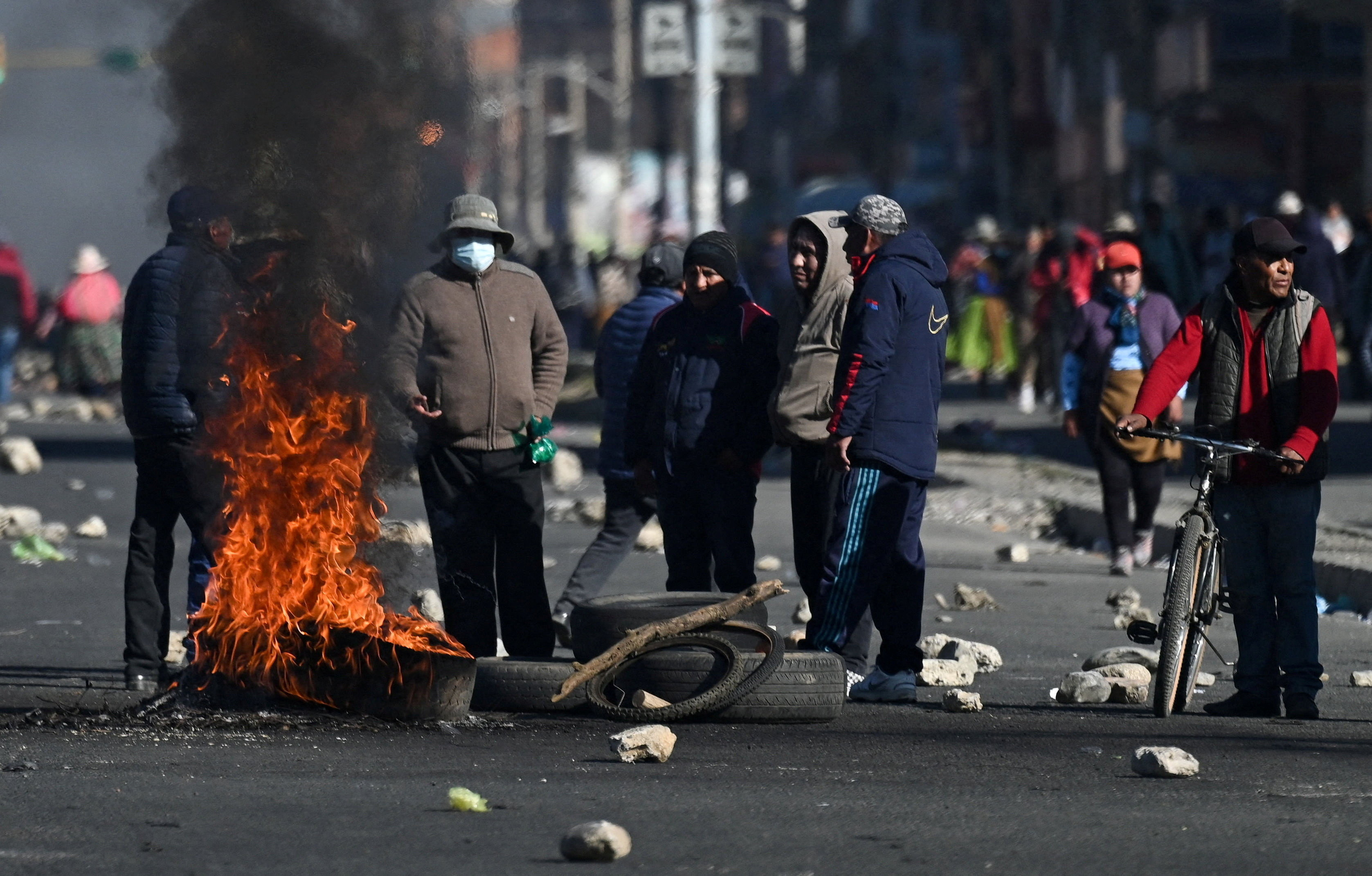 Protesters stand next to burning tyres as they demonstrate against President Rodrigo Paz's government amid an ongoing economic and fuel crisis, in El Alto, Bolivia, May 16, 2026. REUTERS/Claudia Morales