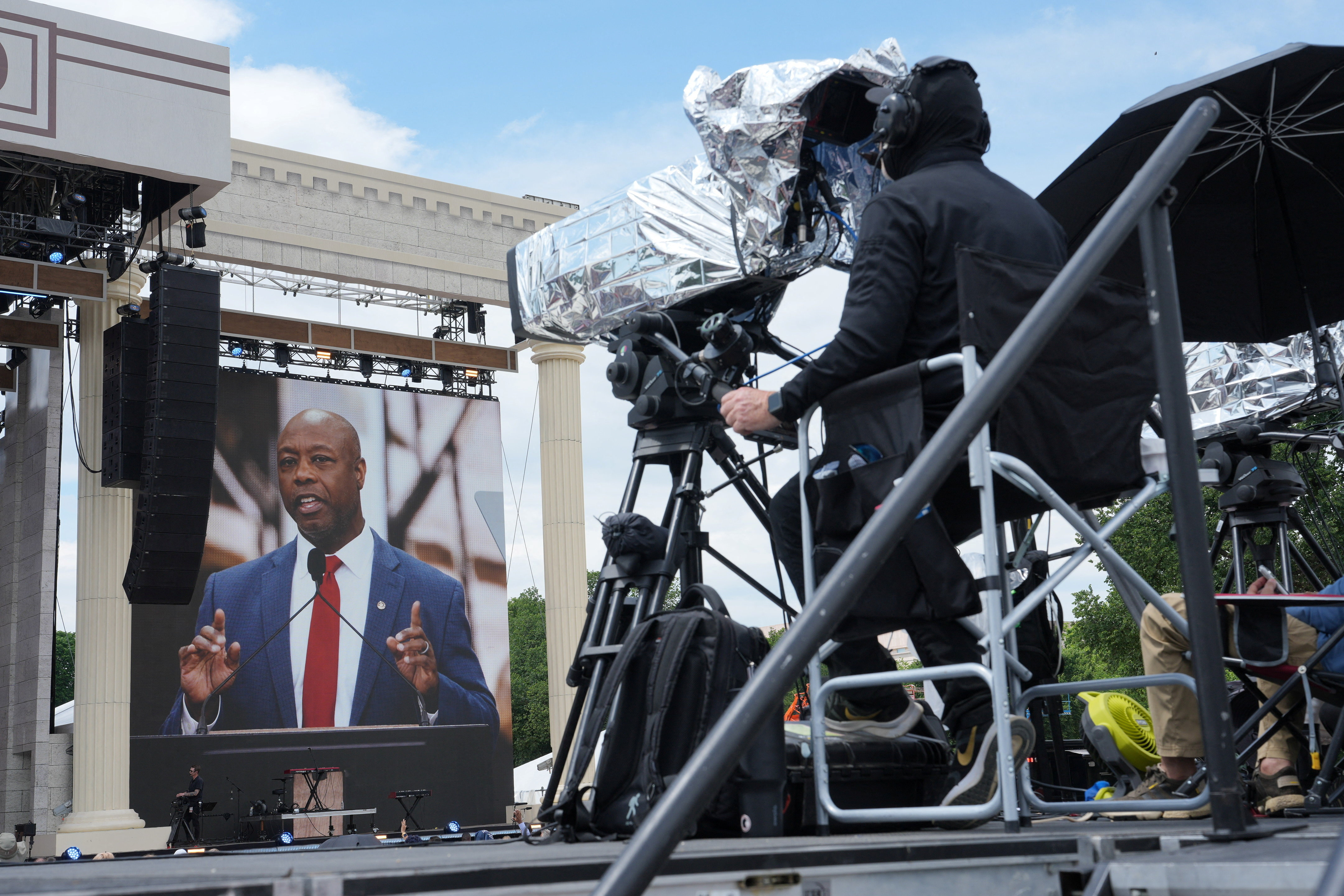 U.S. Senator Tim Scott (R-SC) is seen on a screen as he participates in Rededicate 250: A National Jubilee of Prayer, Praise & Thanksgiving at the National Mall in Washington, D.C., U.S., May 17, 2026. REUTERS/Eric Lee