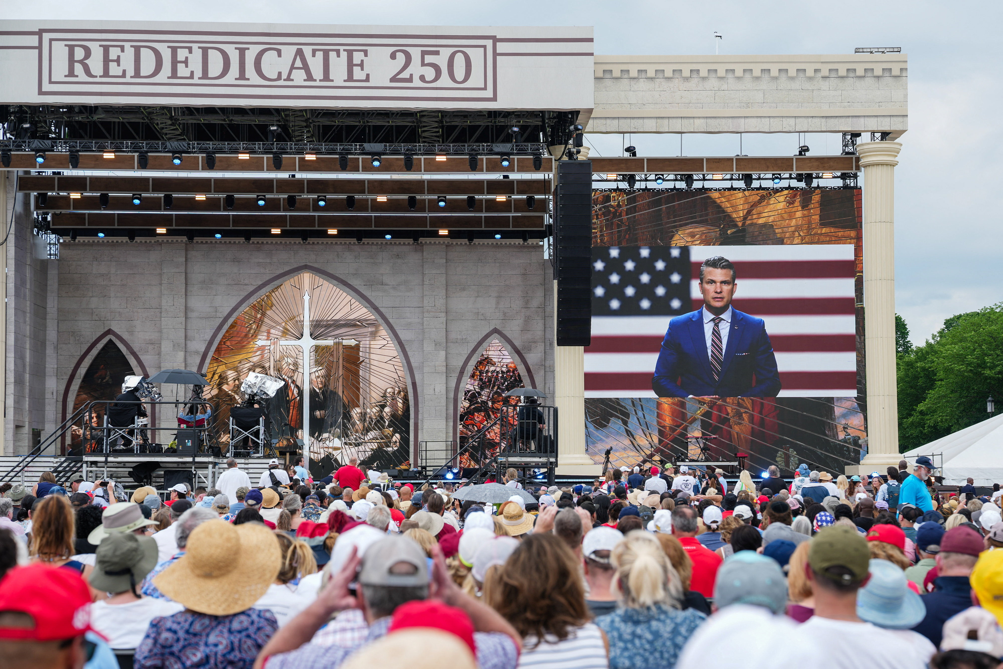 A video message of U.S. Secretary of Defense Pete Hegseth plays during Rededicate 250: National Jubilee of Prayer, Praise & Thanksgiving on the National Mall in Washington, D.C., U.S., May 17, 2026. REUTERS/Eric Lee
